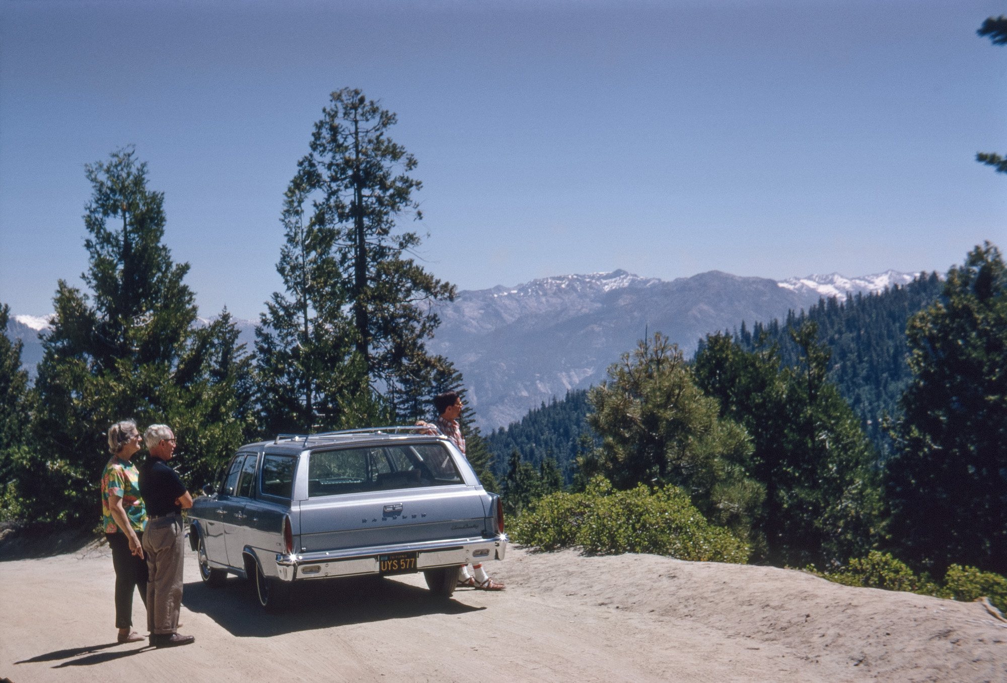 Summer 1967. Just think how much more exciting this shot of my mother, father and brother enjoying a Kodachrome vista of the Sierra Nevada would be if, instead of our sedate 1966 Rambler, we had a red 1960 Chevy wagon. View full size.