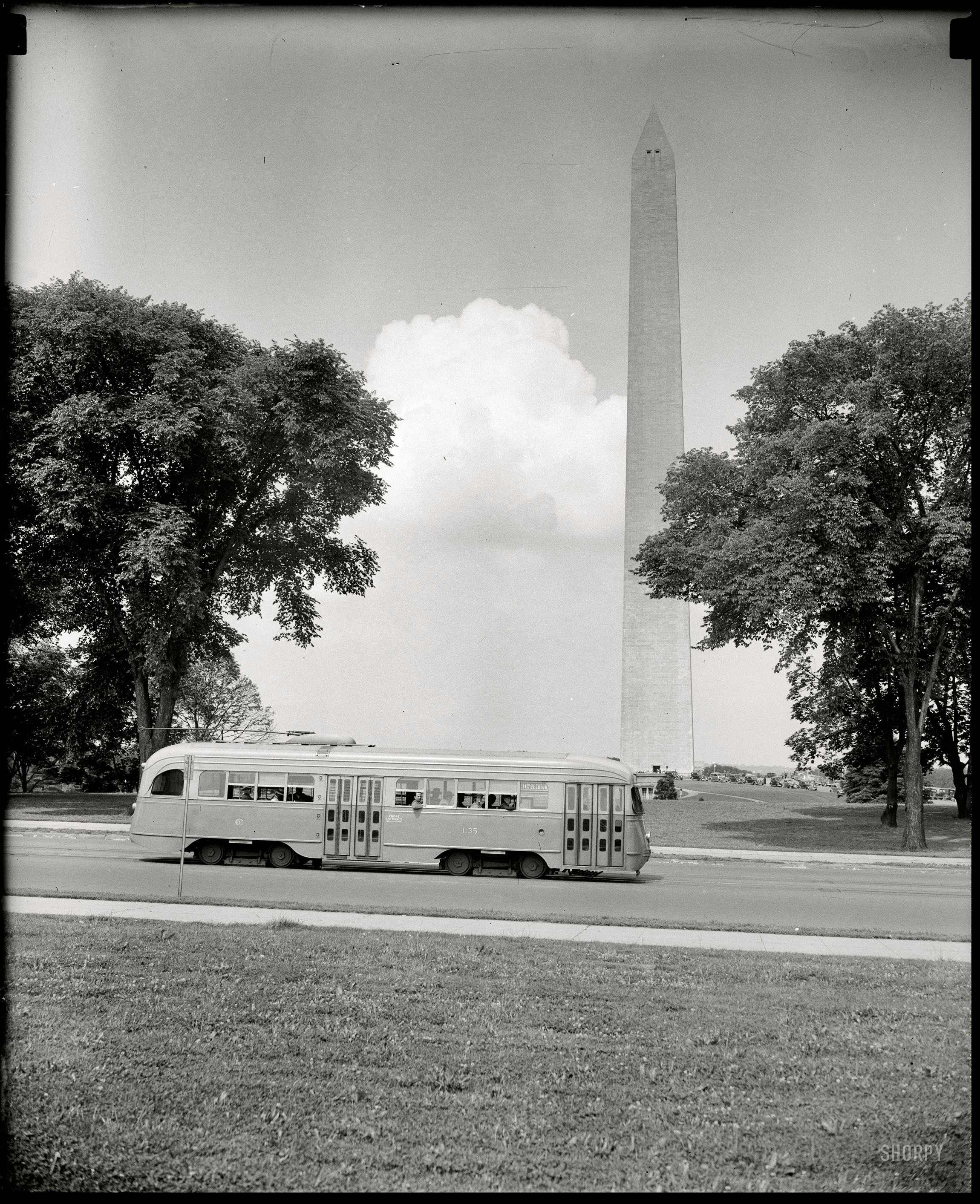 Washington, D.C., circa 1938. "Streamlined street car passing Washington Monument." Harris & Ewing Collection glass negative. View full size.