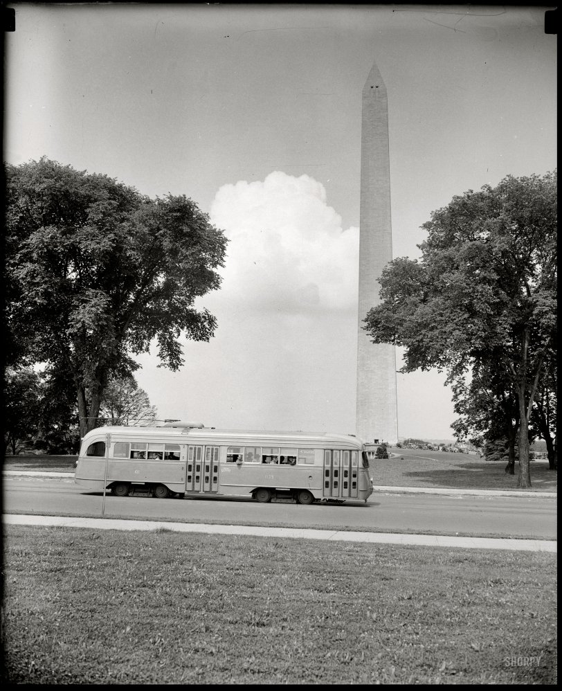 Washington, D.C., circa 1938. "Streamlined street car passing Washington Monument." Harris &amp; Ewing Collection glass negative. View full size.
