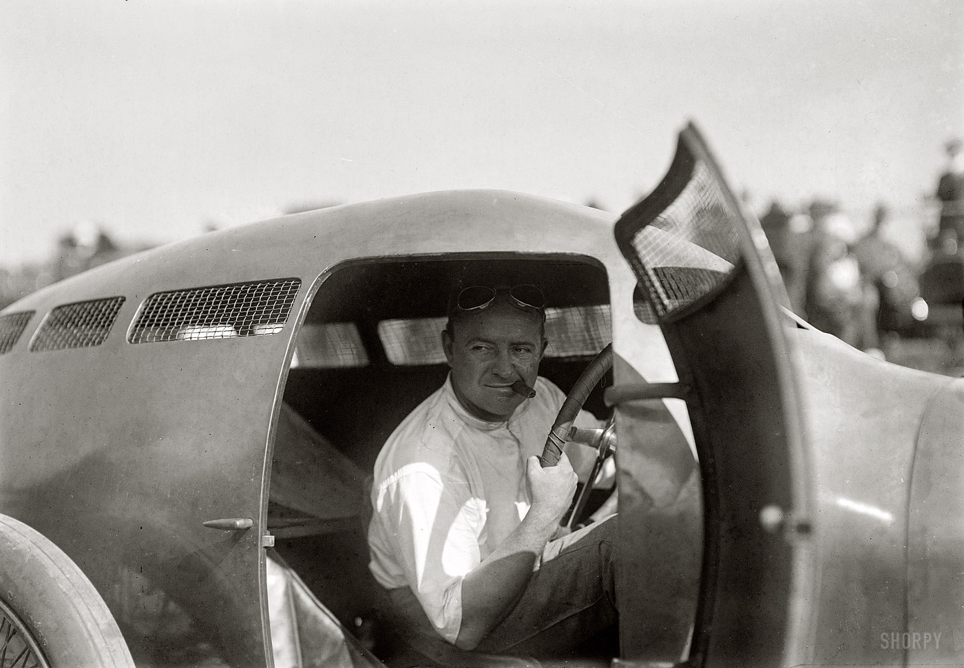 August 18, 1917. Racecar driver Barney Oldfield in the cockpit of his Golden Submarine at the Sheepshead Bay "speed carnival" in Brooklyn. 5x7 glass negative, George Grantham Bain Collection. View full size.