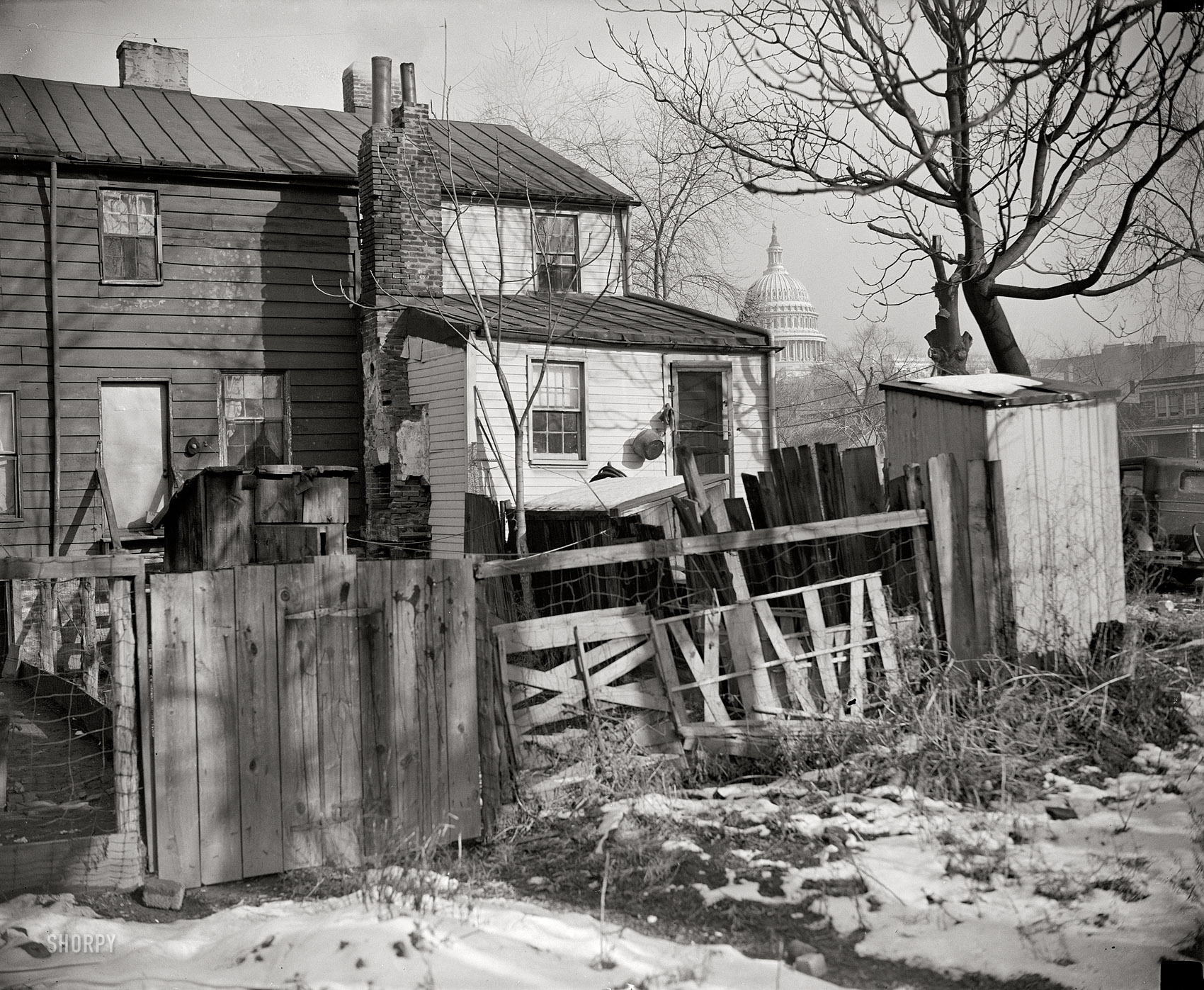 November 30, 1938. "Now that President Roosevelt has approved the $15 million low rent housing program for the District of Columbia, such slum scenes as this will disappear from the 'city beautiful.' This picture was made within a stone's throw of the U.S. Capitol." Harris & Ewing glass negative. View full size.