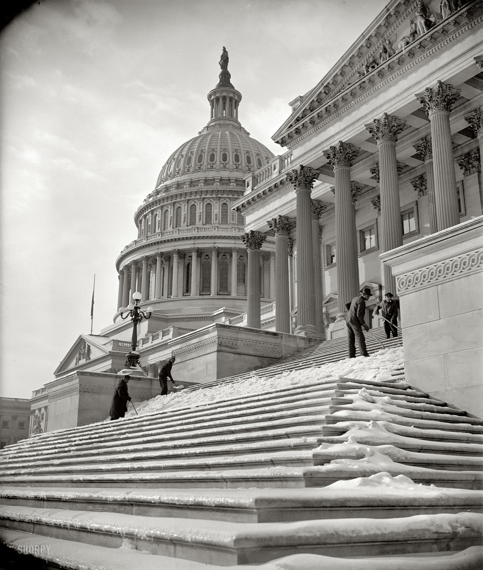 January 14, 1939. "National Capital digs out after storm. Nearly five inches of snow blanketed Washington yesterday, followed by sleet. Icy steps made the going to and from the Capitol difficult until workmen arrived this morning and scraped away the menace." Harris & Ewing Collection glass negative. View full size.