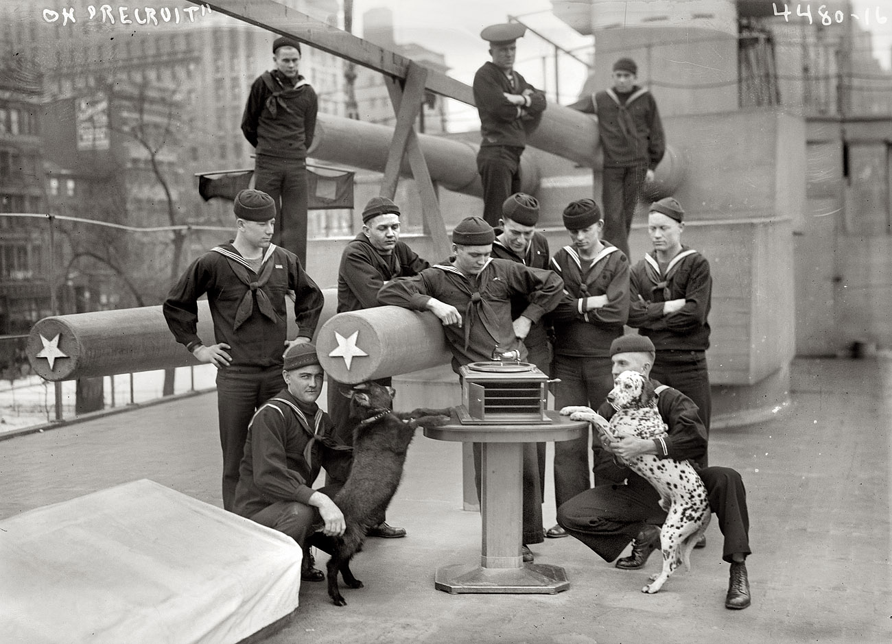 New York, 1917. Another shot of the sailors and mascots aboard the U.S.S. Recruit, a mock battleship moored in Union Square as a Naval recruiting station. View full size. 5x7 glass negative, George Grantham Bain Collection.