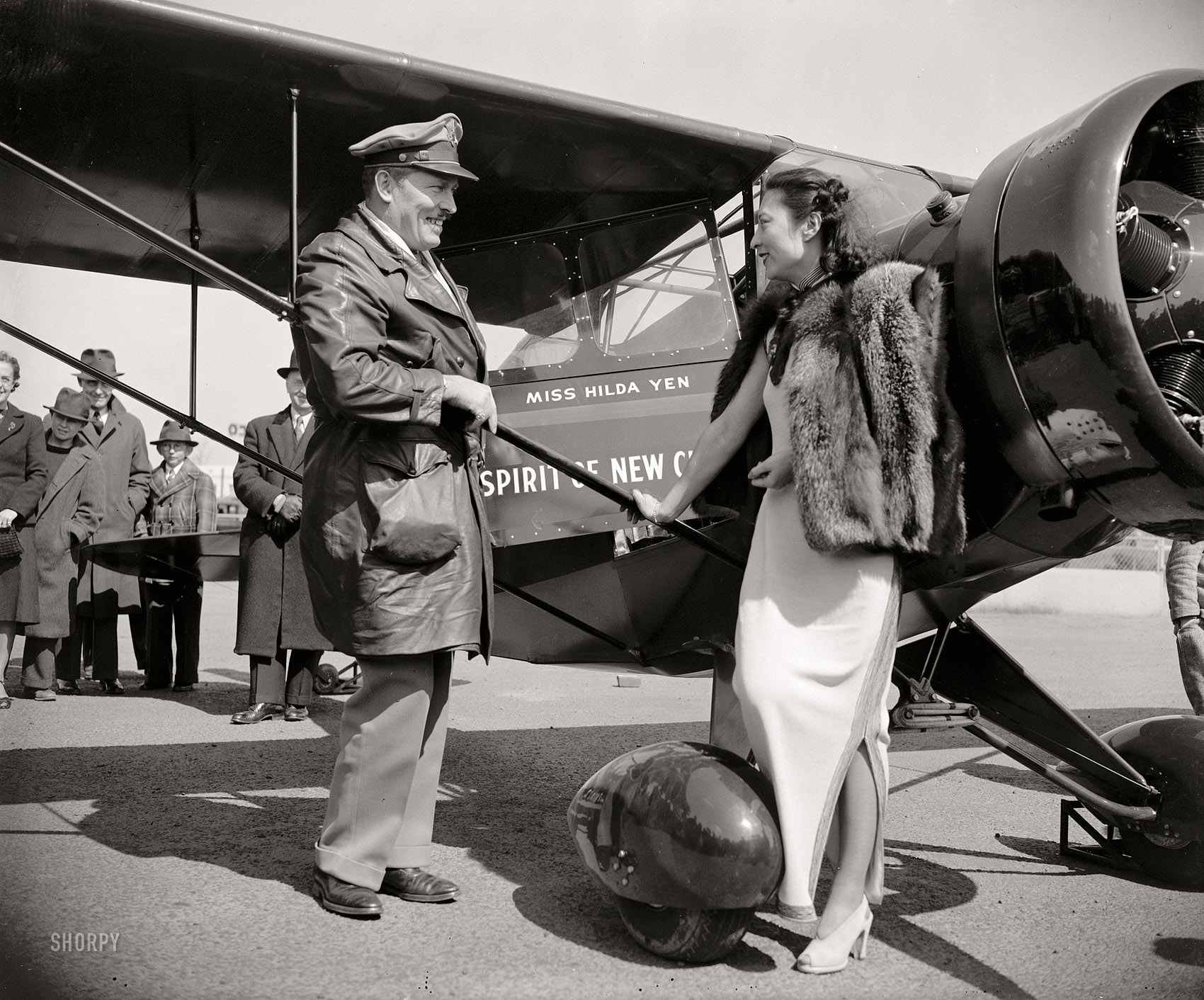 April 3, 1939. Washington, D.C. "Col. Roscoe Turner, winner of speed trophies in the air, dropped down to Washington Airport today with a red high-wing monoplane which he presented to the friends of New China, represented by Miss Hilda Yen, Chinese Aviatrix. The plane, 'Spirit of New China.' was built by the Porterfield factory." Harris & Ewing Collection glass negative. View full size.
