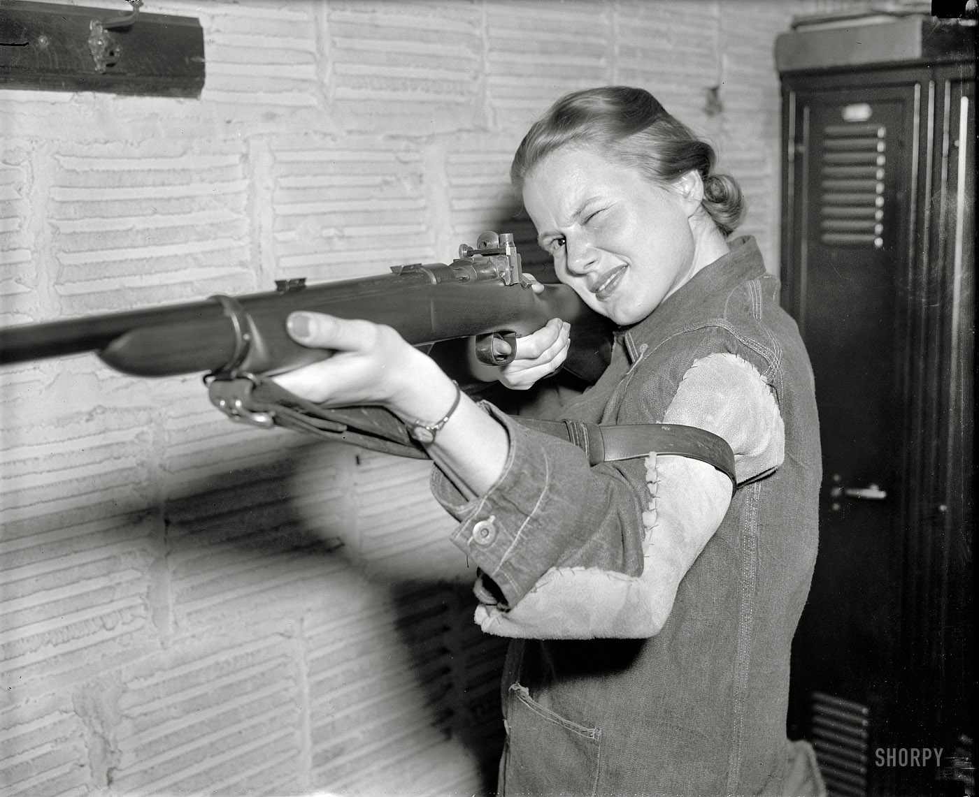 April 6, 1939. "Co-ed queen of rifle shooters. Jean Yocum, George Washington University co-ed, has won the Women's Individual Intercollegiate Rifle Championship, according to the National Rifle Association. Her score of 496 out of a possible 500 gave the individual title to a G.W. girl for the first time since 1929. Although this is only Miss Yocum's second year of shooting, she has maintained an average of 99 out of a possible 100 in all matches." View full size.