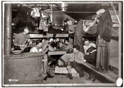 April 17, 1918. Army Signal Corps music-makers in a logging  camp bunkhouse at Hoquiam, Washington. View full size. 5x7 glass negative, George Grantham Bain Collection. Starting in 1917 the Army sent 10,000 soldiers to Oregon and Washington logging camps to cut timber as part of an effort to harvest 10 million board-feet of spruce a month for aircraft construction. 