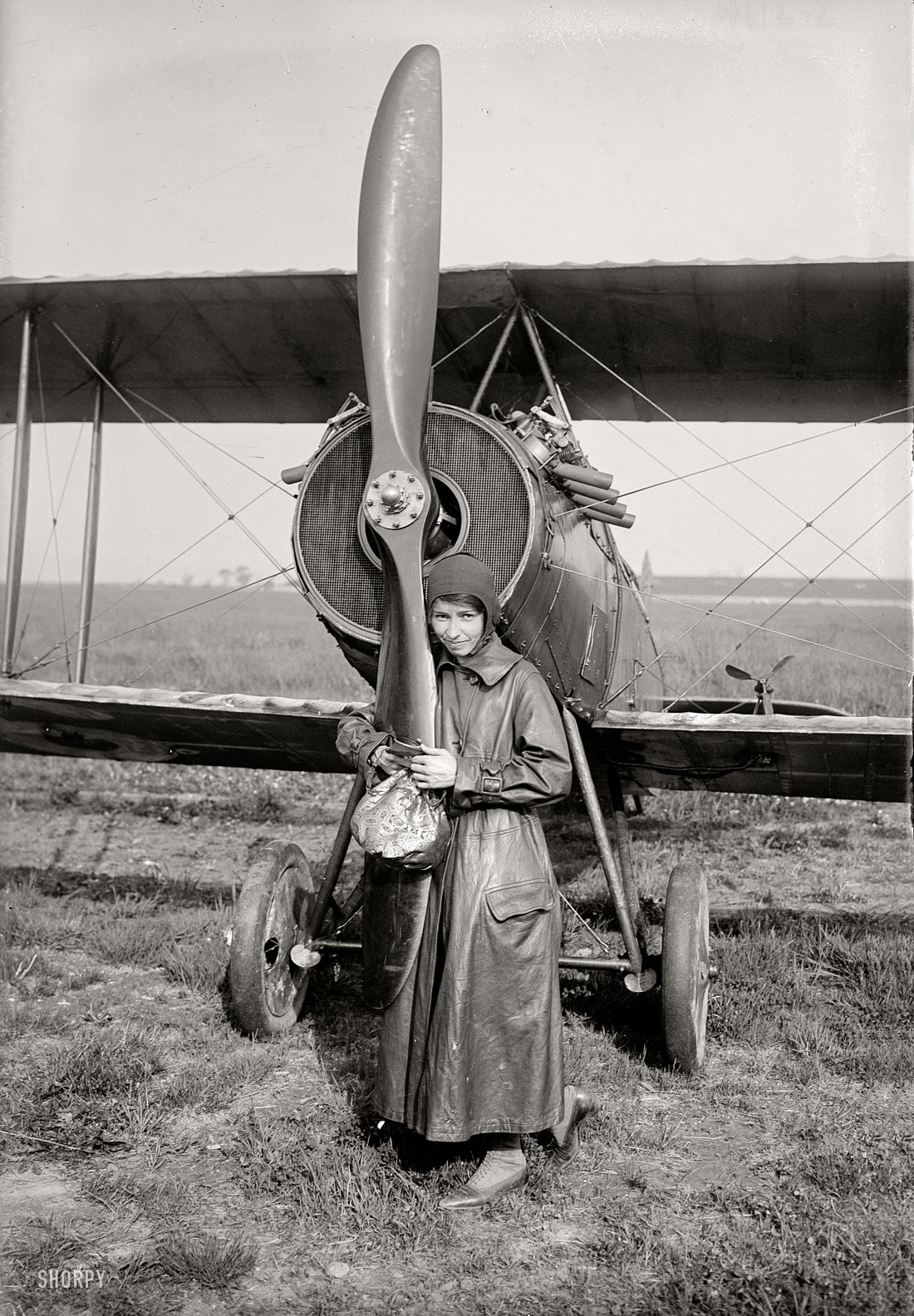 June 1, 1918. Katherine Stinson, "the flying schoolgirl," and her plane at Sheepshead Bay Speedway in Brooklyn after completing a flight from Chicago. 5x7 glass negative, George Grantham Bain Collection. View full size.