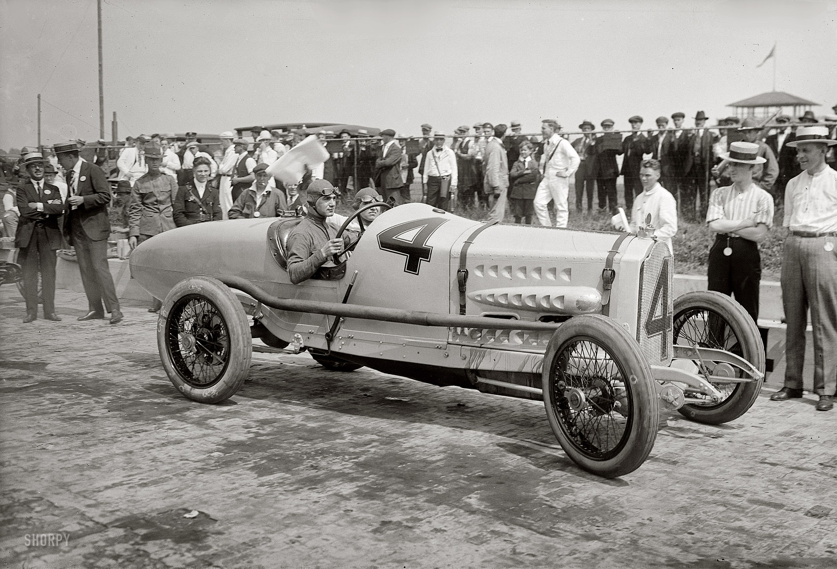 June 1, 1918. The Italian racecar driver Ralph DePalma and mechanic in the Packard that won the Harkness Handicap at Sheepshead Bay Speedway in Brooklyn. 5x7 glass negative, George Grantham Bain Collection. View full size.