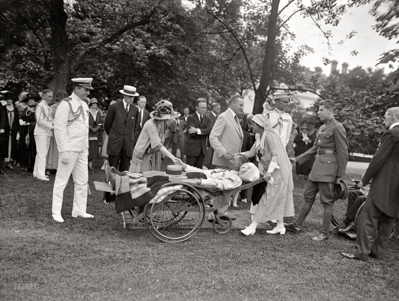 May 21, 1925. "White House garden party for wounded veterans. President and Mrs. Coolidge greeting guests." National Photo glass negative. View full size.
