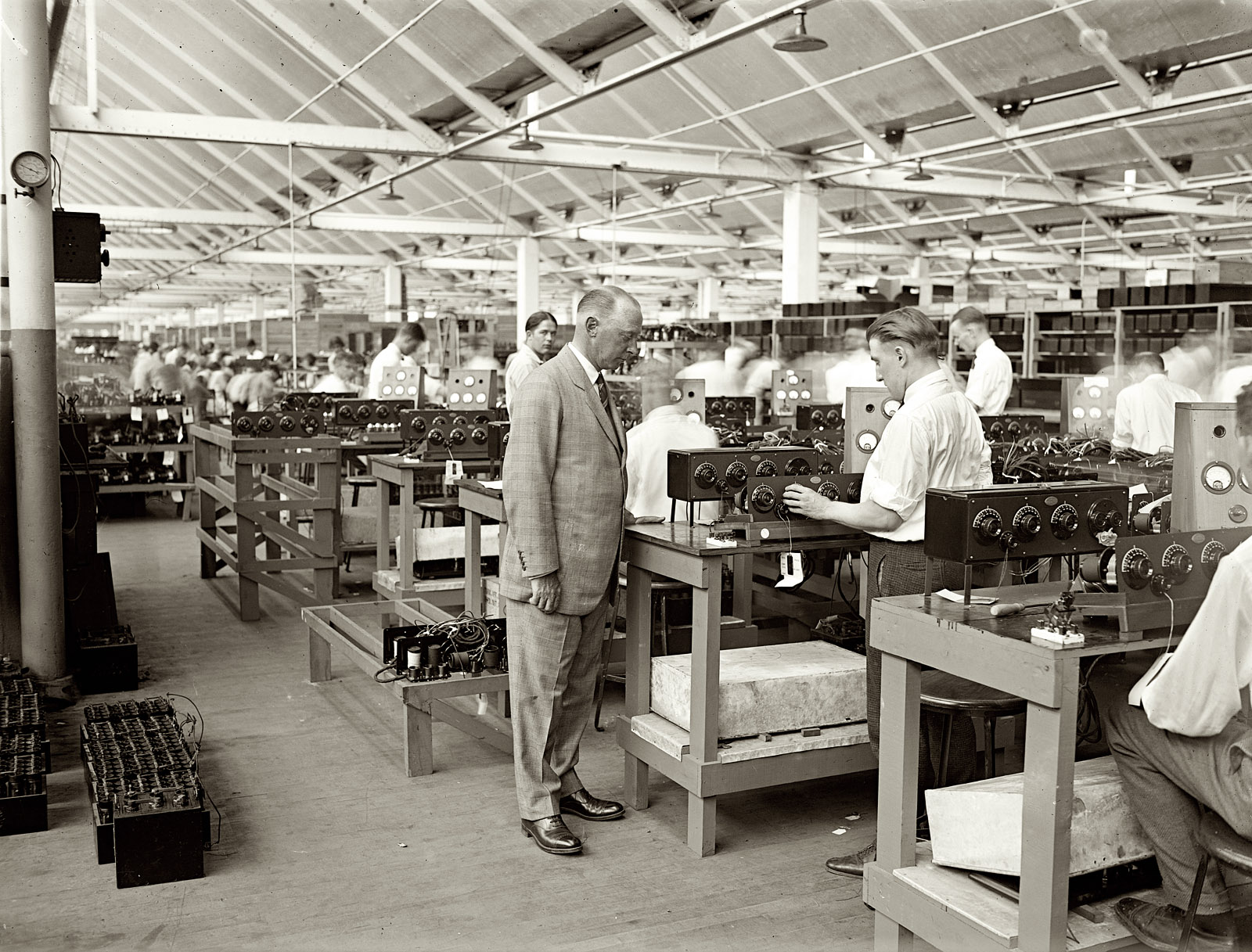 1925. "Atwater Kent at test table." Namesake of the Atwater Kent radio empire at his Philadelphia factory. View full size. National Photo Company Collection.