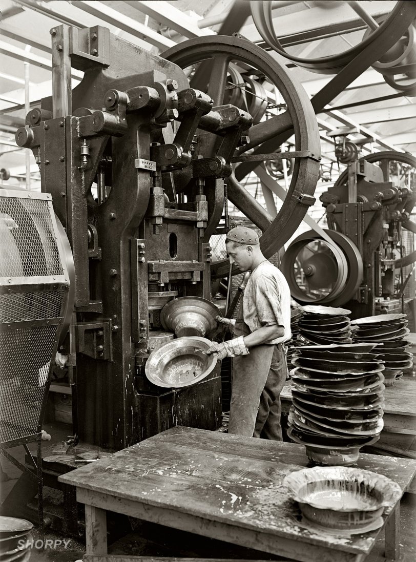 Philadelphia, 1925. Stamping loudspeaker bells at the Atwater Kent radio factory. View full size. National Photo Company Collection glass negative.
