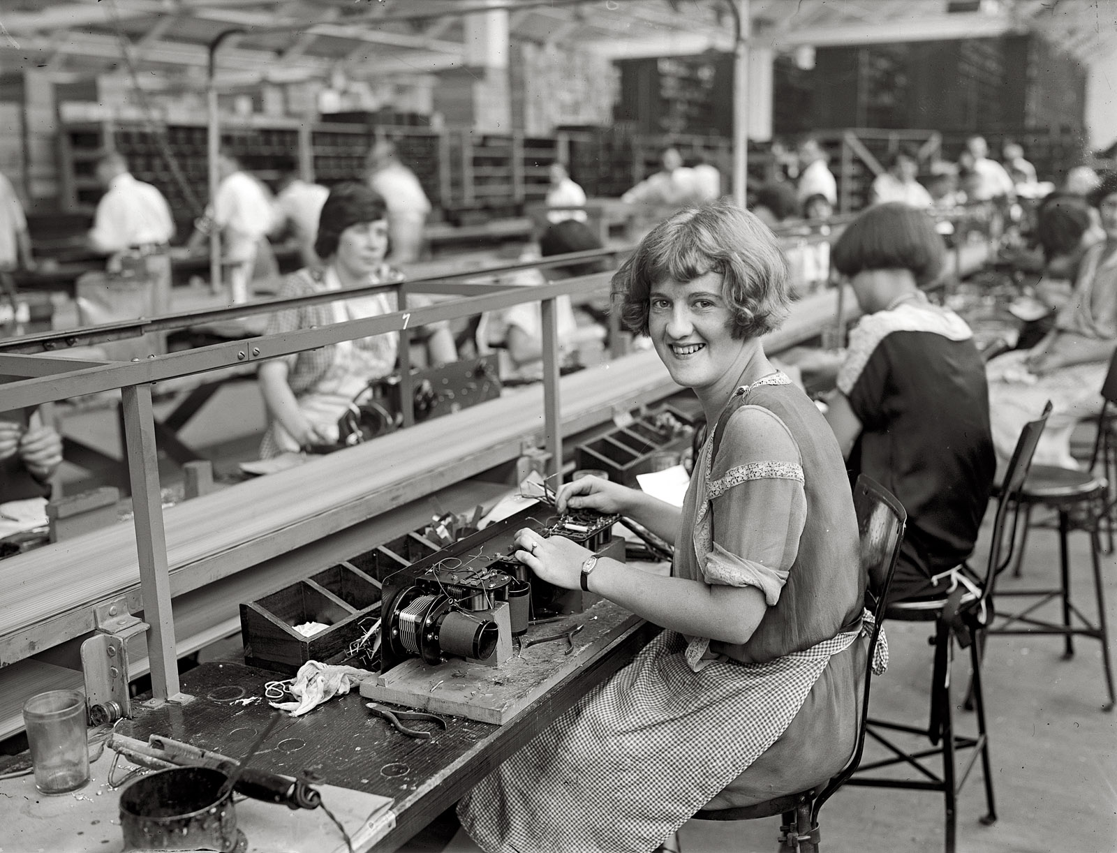 1925. "Starting assembly of set (Mary Ramsey)." A worker at the Atwater Kent radio factory in Philadelphia. National Photo glass negative. View full size.