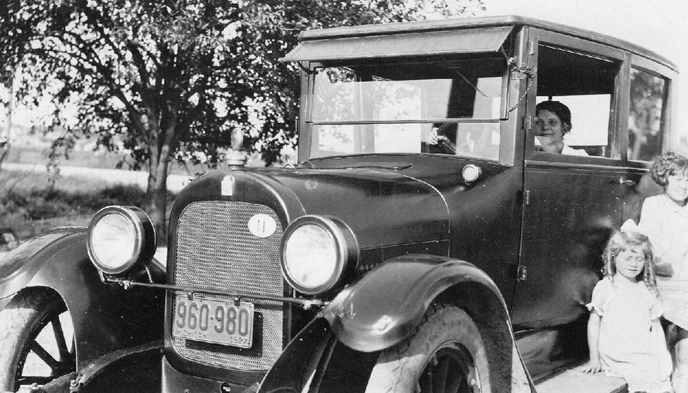 My grandmother, Margaret Sendelbeck, behind the wheel of the family 1924 Durant (note the 1927 license plate). Her two daughters, Elise and Gretel, decorate the running board.

This was a posed photo, because Grandma never drove ... but she does look like she knows what she's doing. Detroit, Michigan, 1927. View full size.