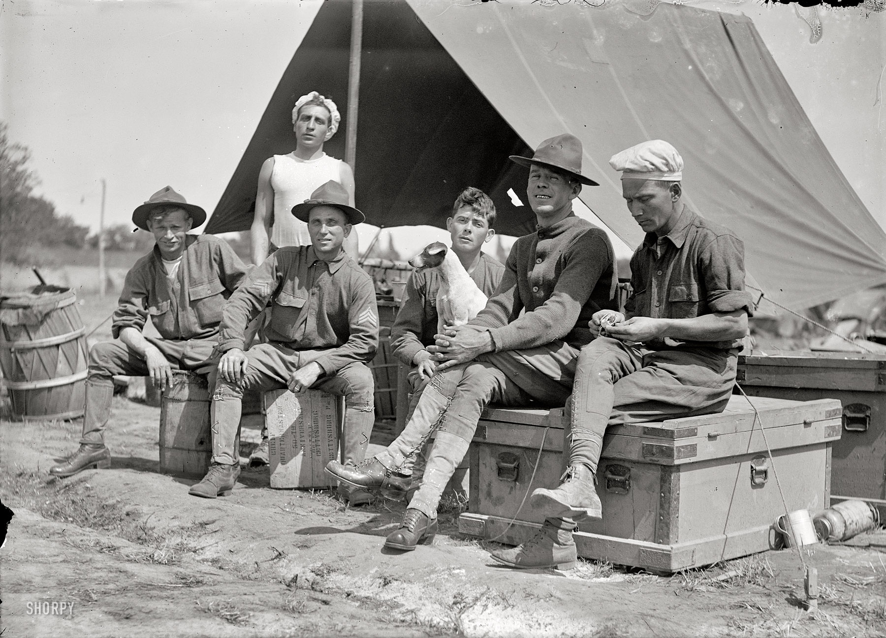 Circa 1913. "Group of soldiers in front of tent." Possibly the National Guard camp at Mount Gretna, Pennsylvania. National Photo glass negative. View full size.