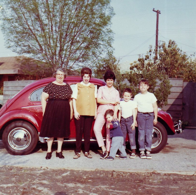 My Grandmother with her jet-black hair, and her three sons (L-R) Mitch, Steve (Father) and Jerry. Check out that gleaming VW Beetle. View full size.
