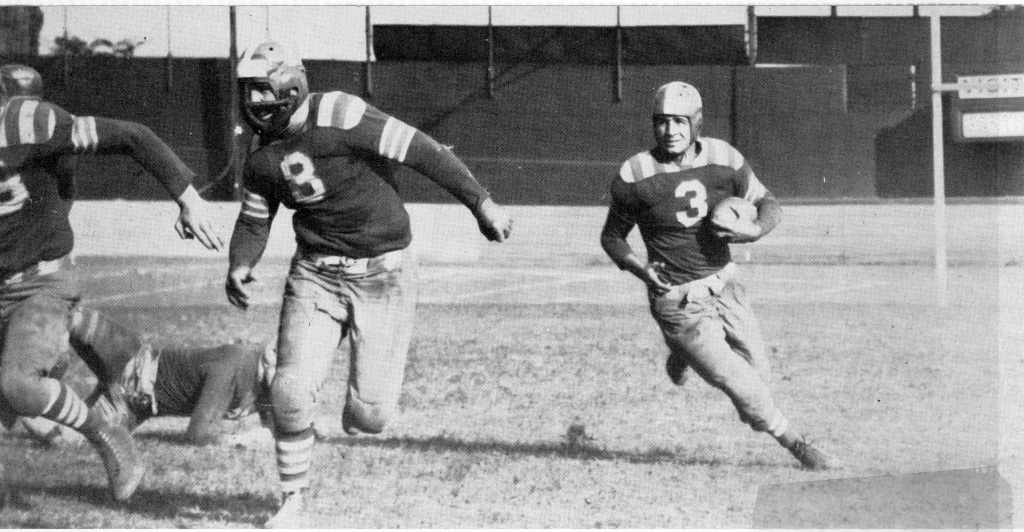 My father playing for the Providence Steamrollers, a professional football team from before WWII. He is running with the ball. 1940, Rhode Island. View full size.