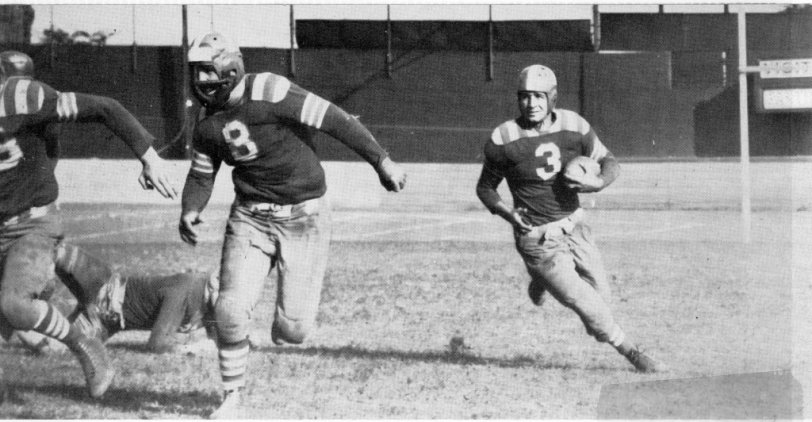 My father playing for the Providence Steamrollers, a professional football team from before WWII. He is running with the ball. 1940, Rhode Island. View full size.
