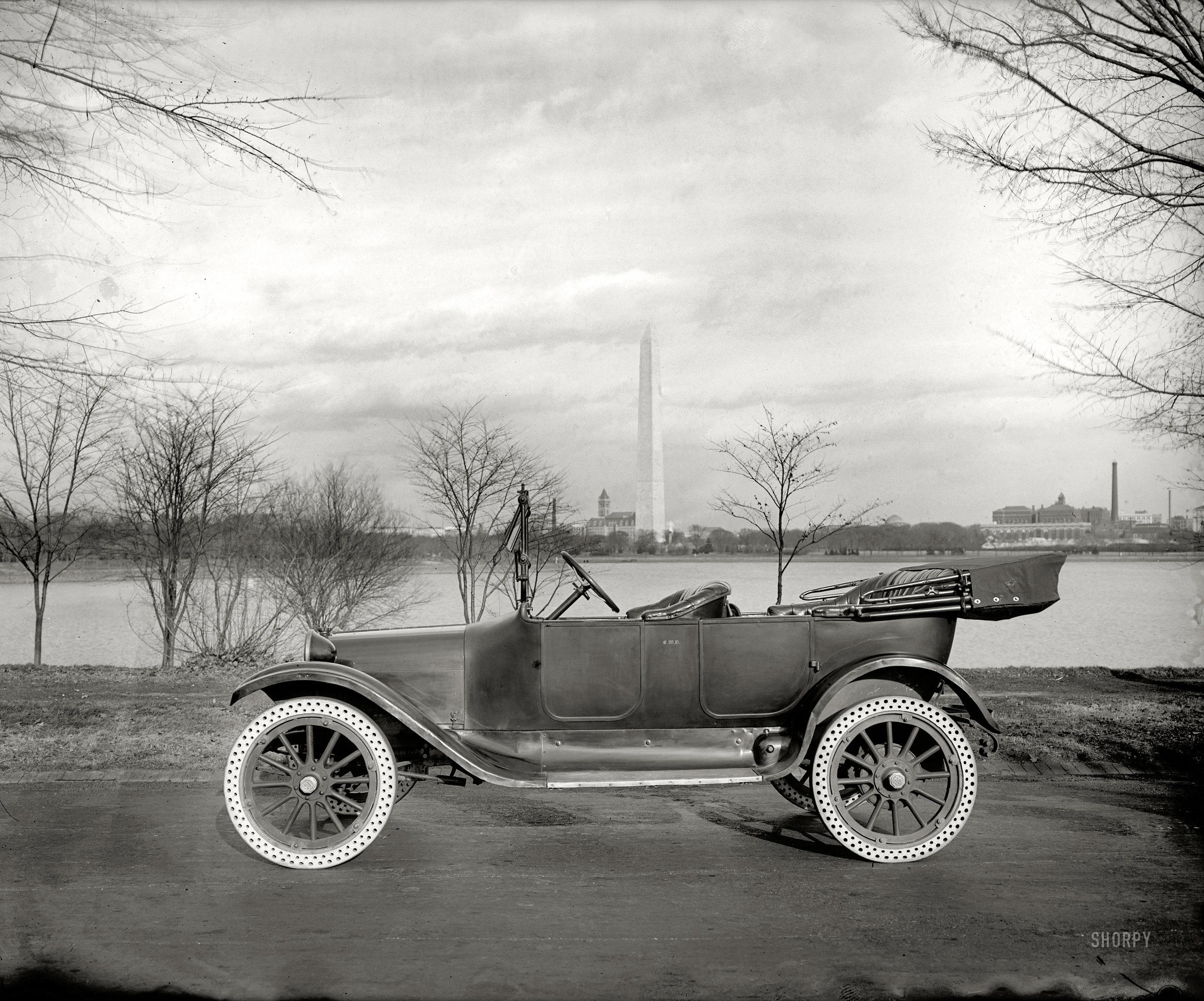 Washington, D.C., circa 1920. "Draper auto." A Dodge touring car bearing the initials of Charles W. Draper and equipped with solid rubber tires similar to the Trublprufs seen in his store window. National Photo Co. View full size.