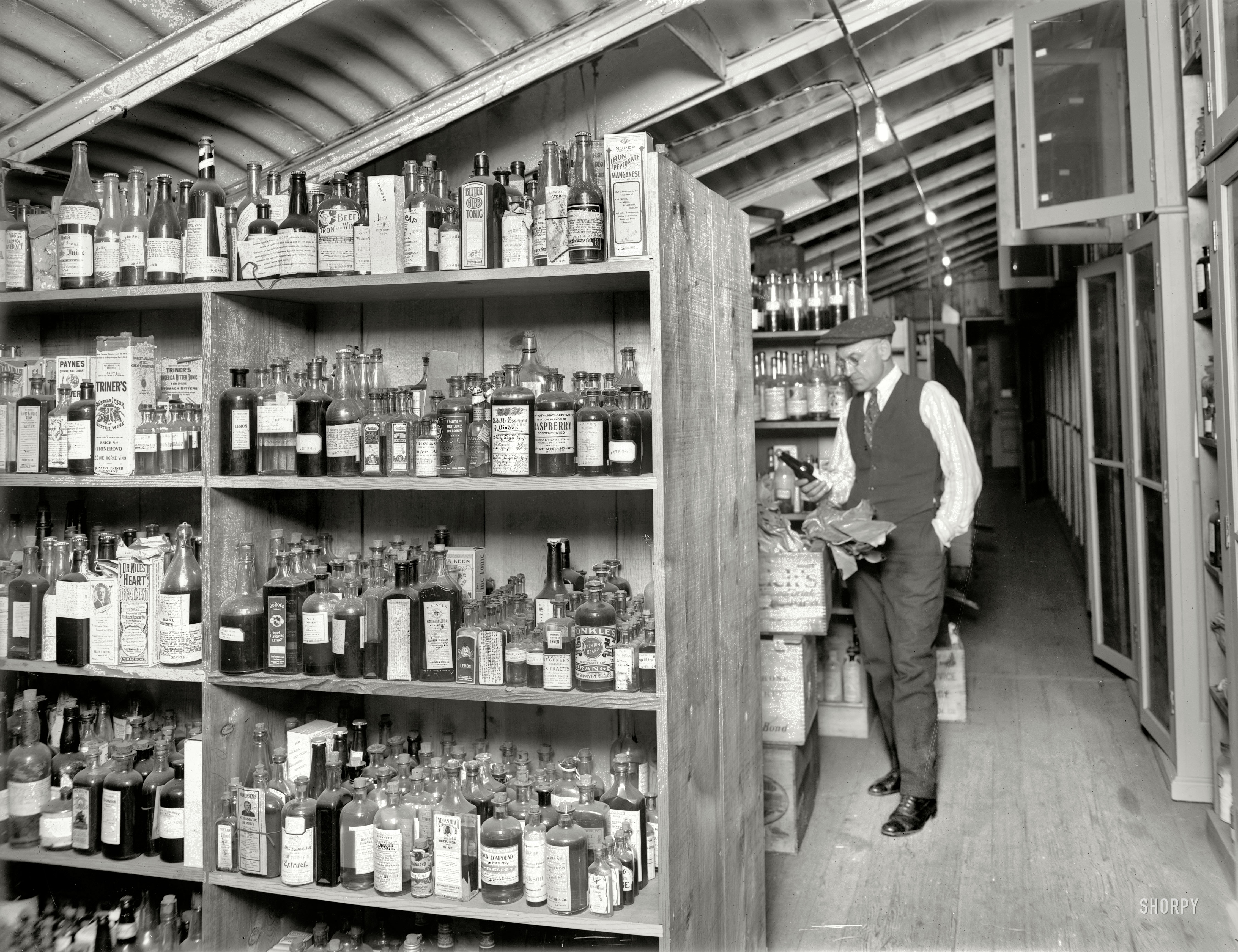 Washington, D.C., 1920. "Treasury Internal Revenue department." An array of essences, extracts and elixirs being tested for alcohol content at the start of Prohibition. National Photo Company Collection glass negative. View full size.