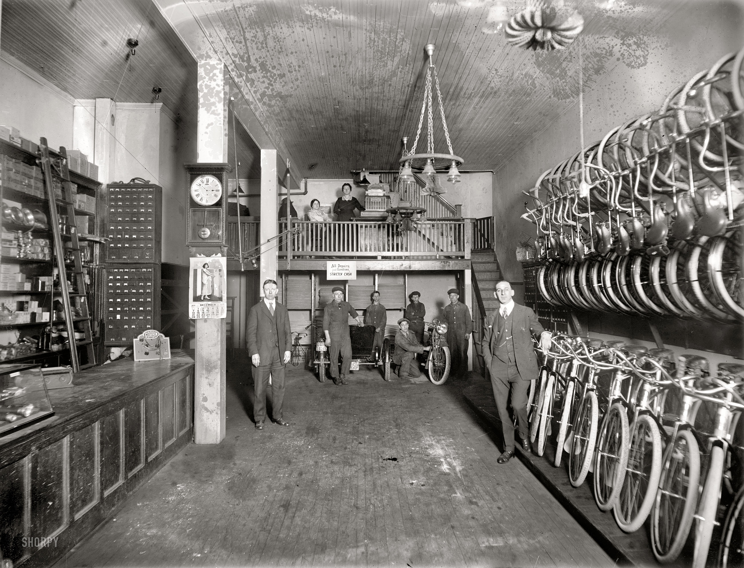 December 1919. Washington, D.C. "Haverford Cycle, interior, 10th Street N.W. Agents for Smith Motor Wheel." National Photo glass negative. View full size.