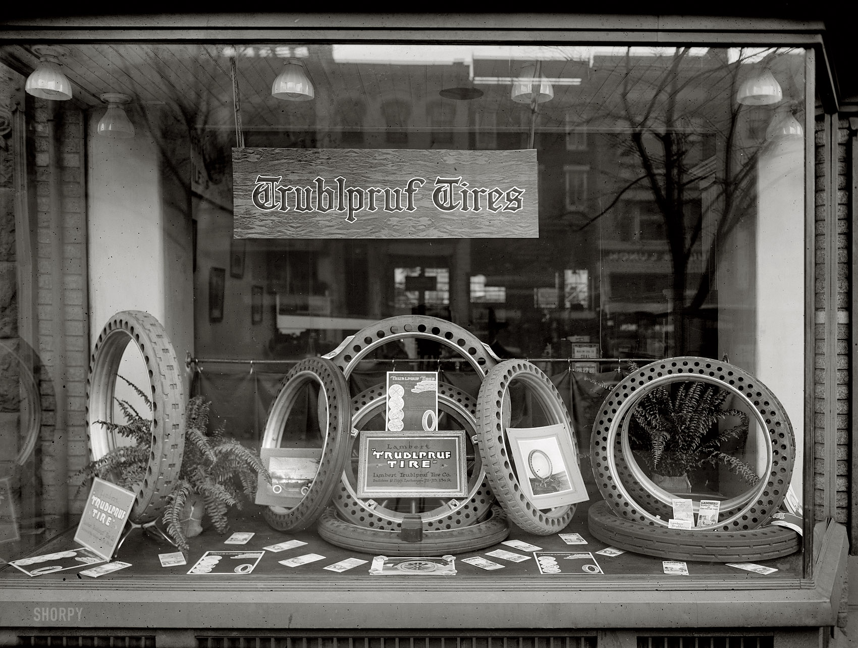 Washington, D.C., circa 1920. "Draper window." A display for Lambert Trublpruf solid rubber tires, a business owned by Charles W. Draper. We've seen these earlier at Shorpy on a few trucks. National Photo glass negative. View full size.