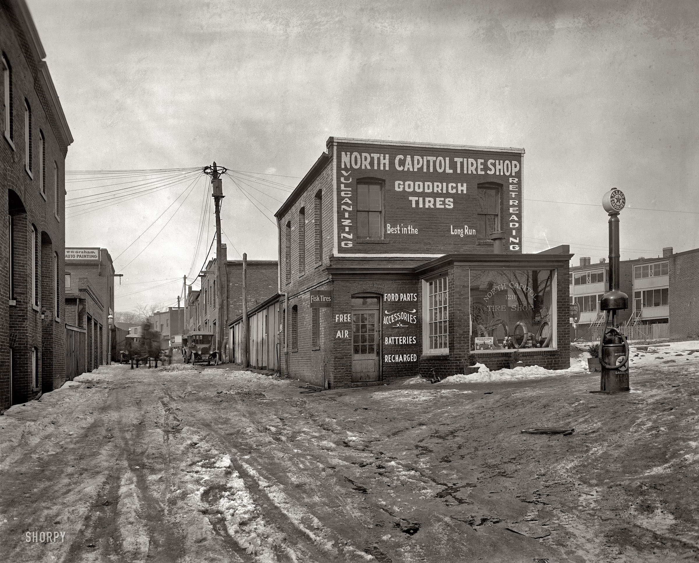 "North Capitol Tire Shop, 1919 or 1920." Approaching the camera: A two-horsepower biofuel vehicle. National Photo Company. View full size.
