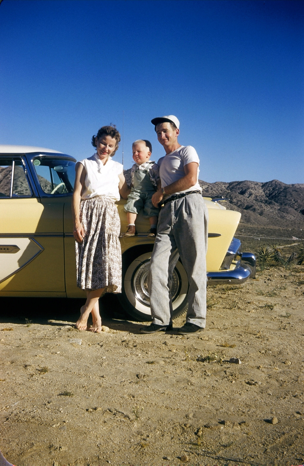 A trip back to the early, early days. My folks and I took a trip to one of my Dad's co-worker's cabin way out in the Mojave desert. Here we are, with our 1956 Plymouth Belvedere. We kept the car well into the 1960s, and I remember it had the infamous push button transmission selector.

The man who took the picture, and who owned the cabin, was Mischa Pelz, who was a fairly prominent photographer in Southern California back in those days. View full size.

