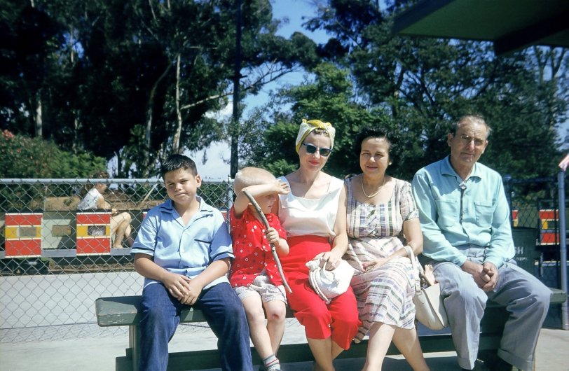 Griffith Park, Traveltown, in the late '50s. This is still a Southern California landmark, near the famed Los Angeles Zoo. This is an area dedicated to old railroad cars and locomotives. 
From the left: The former notorious LA sports team owner, moi, Mom, Grandma and Grandpa. Both of the older males were featured in a few of my previous pictures.
My Dad, as usual, was the cameraman. This December as he struggles with dementia, I hold our memories close. View full size.
