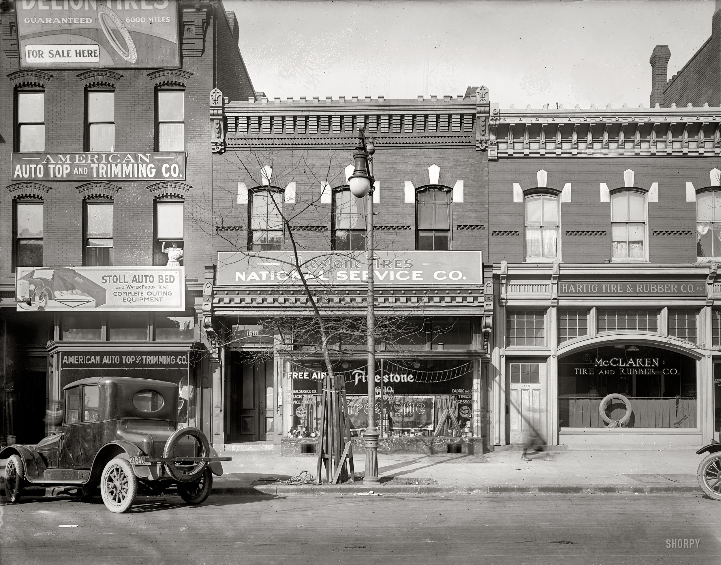 Washington, D.C., circa 1920. "National Service Co. front, 1610 14th Street N.W." Home of 24-hour tire service. National Photo Co. glass negative. View full size.