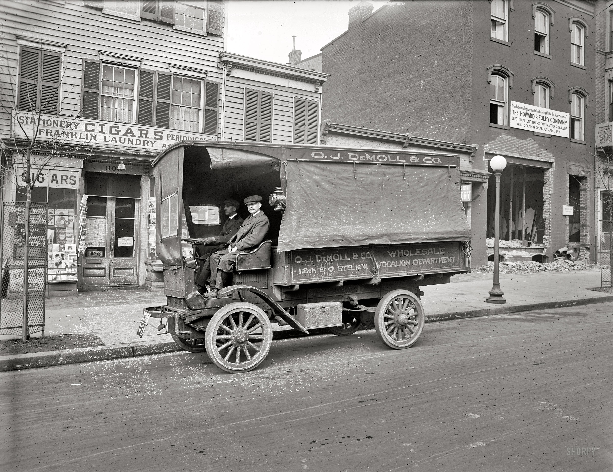 Washington, D.C., circa 1920. "O.J. DeMoll Co., Autocar truck." The cigar store has an interesting selection of magazines, including one called Saucy Stories. Mold-spotted National Photo Company glass negative. View full size.