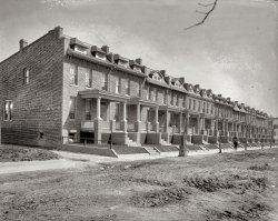District of Columbia, 1919 or 1920. "Washington Times, 609 to 637 Princeton Street." View full size. National Photo Company Collection glass negative.
Thanks to Stanton SquareI would like to thank Stanton Square for the articles and pictures he provides to add to our knowledge of places like this.
RowhousesCould be from a current brochure!!  Very contemporary.
[Nowadays you'd most likely see brick on the front and vinyl siding left, right and rear. - Dave]
Still thereStill there (click image to enlarge):

TodayNot to mention that you could very well pay as much for one house as the original builder spent to build the whole street.
This Old HouseYou got that right, Brent.  My parents' first home, a new rowhouse in the Sunset District of San Francisco, cost $5,000 in about 1939.  Last I heard that same house would cost close to $400,000!  
$445kAccording to zillow.com the current value of 639 Princeton Place is $445,000.
637 Princeton Place Northwest, Washington, DC
Public Facts:
    * Single family
    * 4 beds
    * 3.0 bath
    * 1,928 sqft
    * Lot 1,844 sqft
    * Built in 1920
Popular Colonial Design.Herman R. Howenstein was another active builder in early 20th century Washington.  According to his brief bio at the Capitol Hill Restoration Society, he was also the builder and owner of the Potomac Park Apartments.

 Washington Post, May 25, 1919

With plans completed for the erection of 135 new homes of various types in the northwest section at a cost of nearly $500,000, the firm of H.R. Howenstein Company have undertaken on of the largest building enterprises of the year.  The firm now has almost completed the 50 homes which have been under construction several months.
Preliminary to the construction work was the purchase last week by this firm from the Kennedy Brothers, Inc., of all the vacant ground fronting on five squares between Park place, Warder street, Georgia avenue, Otis, Princeton, Quebec streets and Rock Creek Church road.  The tract comprises 135 building lots.
The new homes to be erected on this tract will be of five different types and of popular colonial design.  A new idea will be followed in building a fireproof garage under each rear porch, with heat and light from the house.  The homes will be placed on the market as rapidly as they are completed.

 Washington Post, Feb 29, 1920: Advertisement

609 to 637 Princeton street N.W.
Open and Lighted Until 8 o'Clock P.M. Daily
A Large, Light Fire-Proof Garage goes with each house.
Take Ninth Street Car to Quebec Street and Walk One Square East, or Phone Us for Auto.
H.R. Howenstein Co.
1314 F St. N.W. - 7th and H Sts. N.E.

$3,000 each609-637 were all built for $45,000, or $3,000 each. H.R. Howerstein, owner and builder, got his permit on June 21, 1919. W.E. Howser was the architect. He also built the 16 on the even side for $48,000.
(The Gallery, D.C., Natl Photo)