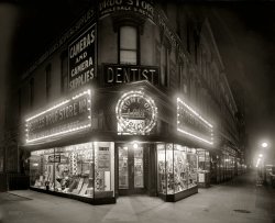 Washington, D.C., circa 1921. "People's Drug Store, Seventh & K, night." With a lurid display of "trusses and rubber goods." National Photo Co. View full size.