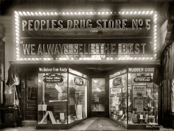 Washington circa 1920. "People's Drug Store, H and 8th Street N.E., night." National Photo Company Collection glass negative. View full size.