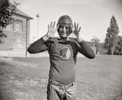 September 11, 1937. "'Slinging Sammy' Baugh, new addition to the Washington Redskins. The Texas Christian U. star is rated as one of the greatest of this generation as far as the passing game goes. Sammy's most recent feat was the practical winning alone of the Green Bay all-stars game at Chicago with a series of sensational passes. He is 24 years old, weighs 190, is six feet tall. Followers of professional football will hear a lot from Sammy this fall." View full size.
Posture&#039;s good, but...His jazz hands need some work.
Greatest QB, everWithout a doubt, this man was the greatest QB in Pro Football history; he invented the modern passing offense, and his jersey number is the only one to be officially retired by the Washington Redskins.
And to think, he probably would have gotten into the HOF as a defensive back or as a punter if he hadn't gone in as QB. He played all three ways, every down, and was a great one.  He led the league in one season alone in passing, pass attempts, completions, touchdowns thrown, interceptions (not the QB stat, the DB stat; he picked off the other teams' QBs), and punting average.
Hail to the Redskins, Hail Victory.
Slingin&#039; SammyI remember him in Saturday matinee serials (circa 1940s) where he was cast as the cowboy hero.
TimingHe was the right player at the right time.  Heck, he'd probably do just fine today!  A great Redskin!  Never to be eclipsed!  Well, maybe by Sonny!
Indians on IceThis looks very similar to the current Chicago Blackhawks  team jersey, except the Indian is facing the other way.

Love the jerseyI wish someone would reproduce it.
Blankety BlankHe could sling, all right - and not just the pigskin.  The man was a world class cusser.  This ol' feller was as crusty as they ever made a man.  Check out any interview where the venerable Texan was quoted verbatim. He generally was amenable to talk to the media, and as he grew older his legendary skills in the Art of Profanity also grew incrementally. 
He was way ahead of his time.  He would be perfect for today's satellite radio.
PhysiqueIts great to see how excellence doesn't depend on being 6'10 and 300 lbs.    
King of the Texas RangersI am watching "King of the Texas Rangers," the 1940s movie serial Sammy starred in as Tom King Jr. Apparently he was a much better football player than he was an actor, as this is pretty much the only movie experience he was to receive.
Jazz HandsI now realize after looking again that he's posed as if someone is throwing him the ball. At first I thought he was vogueing or making some kind of a silly mime gesture. "Here I am!"
Anyway - Hail Redskins, indeed.
Bring him BackThe Redskins need him -- NOW.
(The Gallery, D.C., Harris + Ewing, Sports)