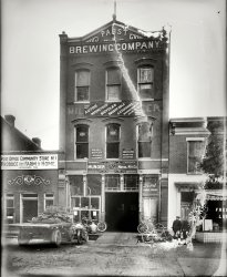 Washington, D.C., circa 1920. "Munger Motor & Mfg. Co., front." On the minus side of the ledger, this glass negative has light leaks, dirt, mold and probably halitosis. On the plus side we have beer, motorbikes, circus posters and Freedom Lunch. This circa 1890s Pabst brewery on North Capitol Street would be returning to its beverage roots (minus the alcohol) in just a few years as the Whistle Bottling Works. National Photo Company Collection. View full size.