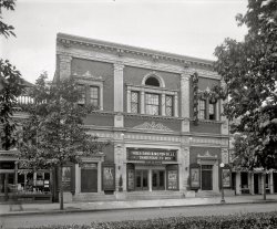 Washington circa 1920. "Crandall's Avenue Grand," 645 Pennsylvania Avenue S.E.  Now playing: "Dangerous to Men." National Photo Co. View full size.
Dr. JJohn Barrymore in "Dr Jekyll &amp; Mrs Hyde." I think I would enjoy that very much. There's so little to see in the movie theatres these days, except at Oscar time. I'm not a great fan of animation. It's not cinema, it's cartoons. 
Avenue Grand

The Avenue Grand
8 Big Acts Each Week
Pictures - Vaudeville
645 Pa. Ave S.E.
Doors Open at 6:30 P.M.


Washington Post, Sep 17, 1910 



Buys the Avenue Grand
Crandall Acquires Picture House in Pennsylvania Avenue

Henry M. Crandall, one of Washington's pioneer motion picture exhibitors, has acquired the Avenue Grand motion picture establishment, in Pennsylvania avenue, between Sixth and seventh streets southeast, and will reopen the theater in about two weeks.
The Avenue Grand is known as the largest motion picture theater here in a residential district.  It has a seating capacity of more than 1,000, and is equipped with a balcony and a stage for straight theatrical productions.

Washington Post, Mar 26, 1916 



Crandall's Avenue Grand Reopens

The reopening of the Avenue Grand under the management of Harry M. Crandall was welcomed by capacity audiences at all performances yesterday and Sunday.  The theater has been thoroughly renovated and redecorated, and a gold screen and an efficient ventilation system has been installed. ...

Washington Post, Apr 18, 1916 


Viola Dana and Milton SillsHer career ended in 1929 when sound movies began;  probably no coincidence.  She died in 1987 at age 90.  He survived the advent of sound but not his heart attack at age 48 in 1930.
Dangerous to MenHey, they made a movie about the Drexel Women's Rifle Team!
Old Movies for NewWhat's interesting is that while "Dangerous to Men" premiered in 1920, "Old Wives for New" came out in 1918.  I wonder why it was showing a movie that had premiered two years prior?
[Second-run showings are nothing new. - Dave]
The shadow manDid anyone notice the shadowy guy in front of M.B. Flynn's Stoves?
J. MuttsThe theater is gone, but the building with the elaborate brickwork on the right (seen through the trees) is still there, now a liquor store.
View Larger Map
Capitol HillRobert K. Headley's "Motion Picture Exhibition in Washington, D.C." has this info about the fate of the Avenue Grand: It was renamed the Capitol Hill between 1956 and 1970.  Don King operated it in the sixties, refurbishing it in 1967, with unrealized plans to make it a cinematheque where patrons could eat.  A fire in November 1970 gutted the building, and it was razed soon after.
(The Gallery, D.C., Movies, Natl Photo)
