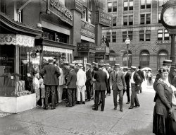 Washington, D.C., circa 1920. "Selinger front, 820 F Street." Onlookers at the wristwatch display seen in the previous post. National Photo Co. View full size.
Get SmartLooks like this is now the International Spy Museum.
View Larger Map
Cheeks of TanWhat were those 2 barefoot boys doing in the midst of all those well dressed people on F Street?
The hands of timeBy now the clock has stopped for everyone here. And it's ticking away for us.
And then the lady under the clock said"You there -- you people in the year two-thousand-and-ten -- have you nothing better to do?"
Wildly entertaining windowsCan't imagine a store window getting that kind of attention nowadays. Of course everyone is dressed to the nines  complete with a suit, tie, and the obligatory boater.
Trend-settersHaving been swept up in the bowler-to-boater groundswell, a group of style-conscious men-about-town check out the latest fashion craze.
I always feel likeSomebody's watching me. Dang that is a big eyeball.
Check out the street urchinsRight out of a Dickens novel. Barefoot, raggedy clothes.
Casing the onlookers looking for an easy mark.
Amazing"Why, they're like pocket watches we can wear on our wrists.  This has to be the greatest invention of the 20th century!"
Fashions of the dayWhile men's clothing didn't really change too much during the decades between the World Wars, ladies' clothing and hemlines sure did! The woman on the far right looks ready to bust up a speakeasy or two with a hatchet -- or just by an icy stare. I'll bet she wouldn't consent to being photographed in bed wearing something lacy, as did the Brox sisters. Or, at least we wouldn't WANT her to.
And across the streetthe bank is now a Gordon Biersch.  Food is meh, but very cool space inside.
(The Gallery, D.C., Natl Photo, Stores & Markets)