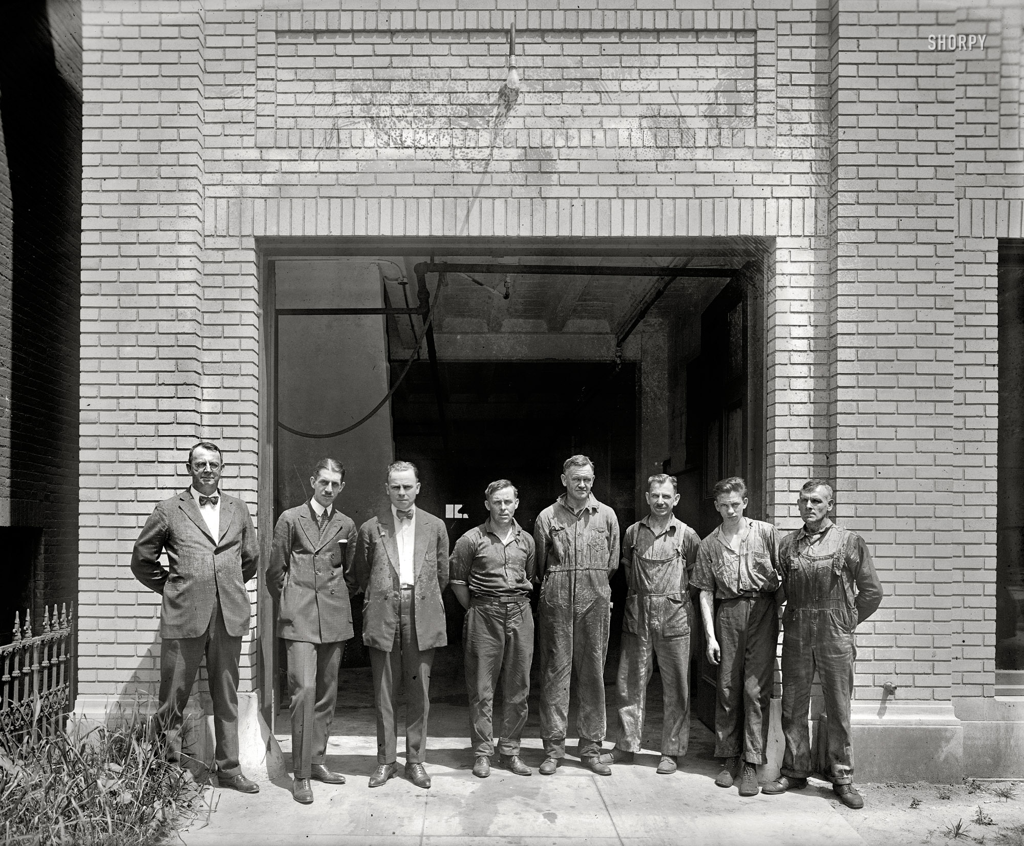 Washington, D.C., circa 1920. "Group, Wayne Smith garage." At this dealer in Haynes automobiles, management and labor pose for posterity. View full size.