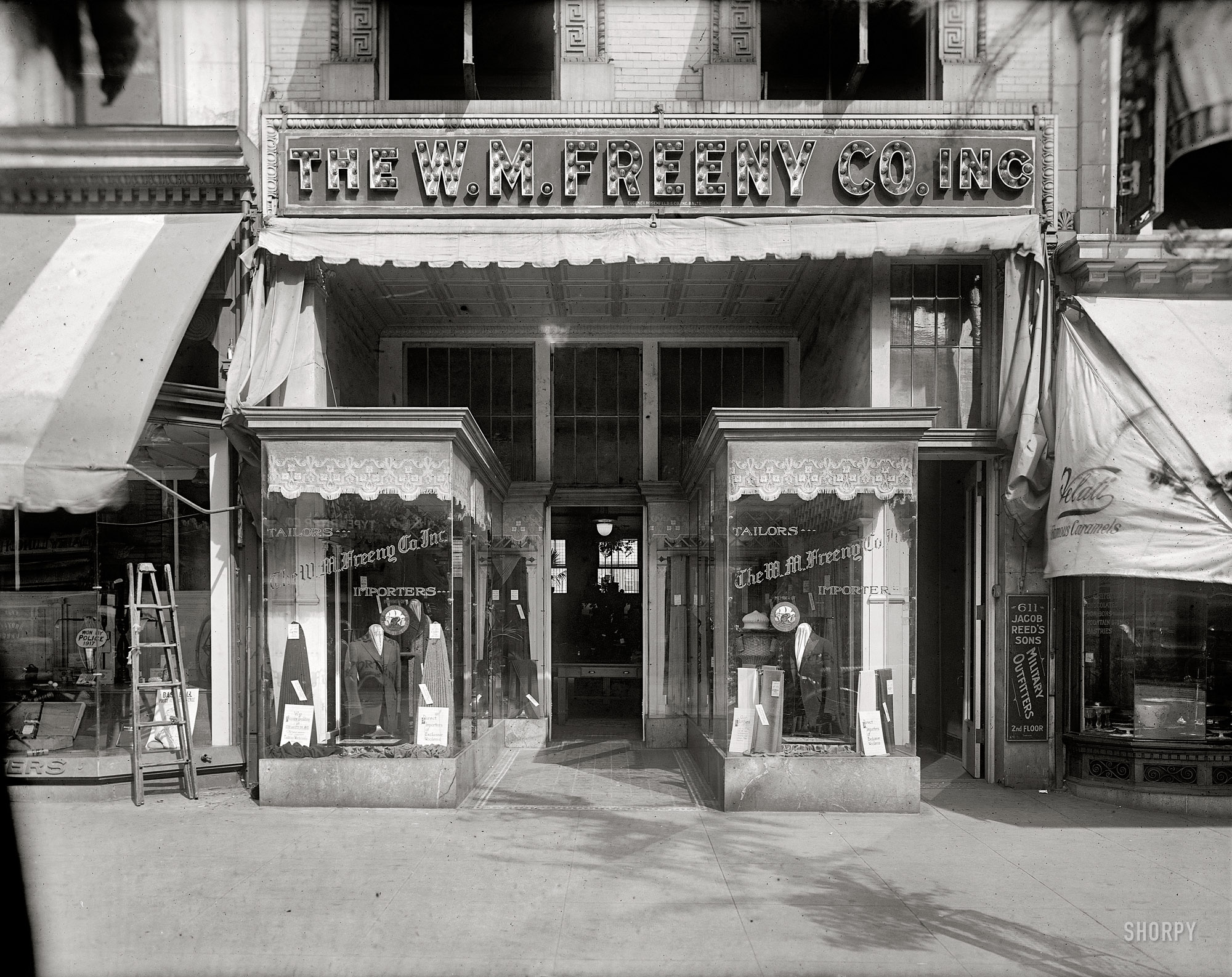 Washington, D.C., circa 1920. "W.M. Freeny Co., front." The W.M. Freeny men's clothing store on 14th Street. National Photo Co. glass negative. View full size.