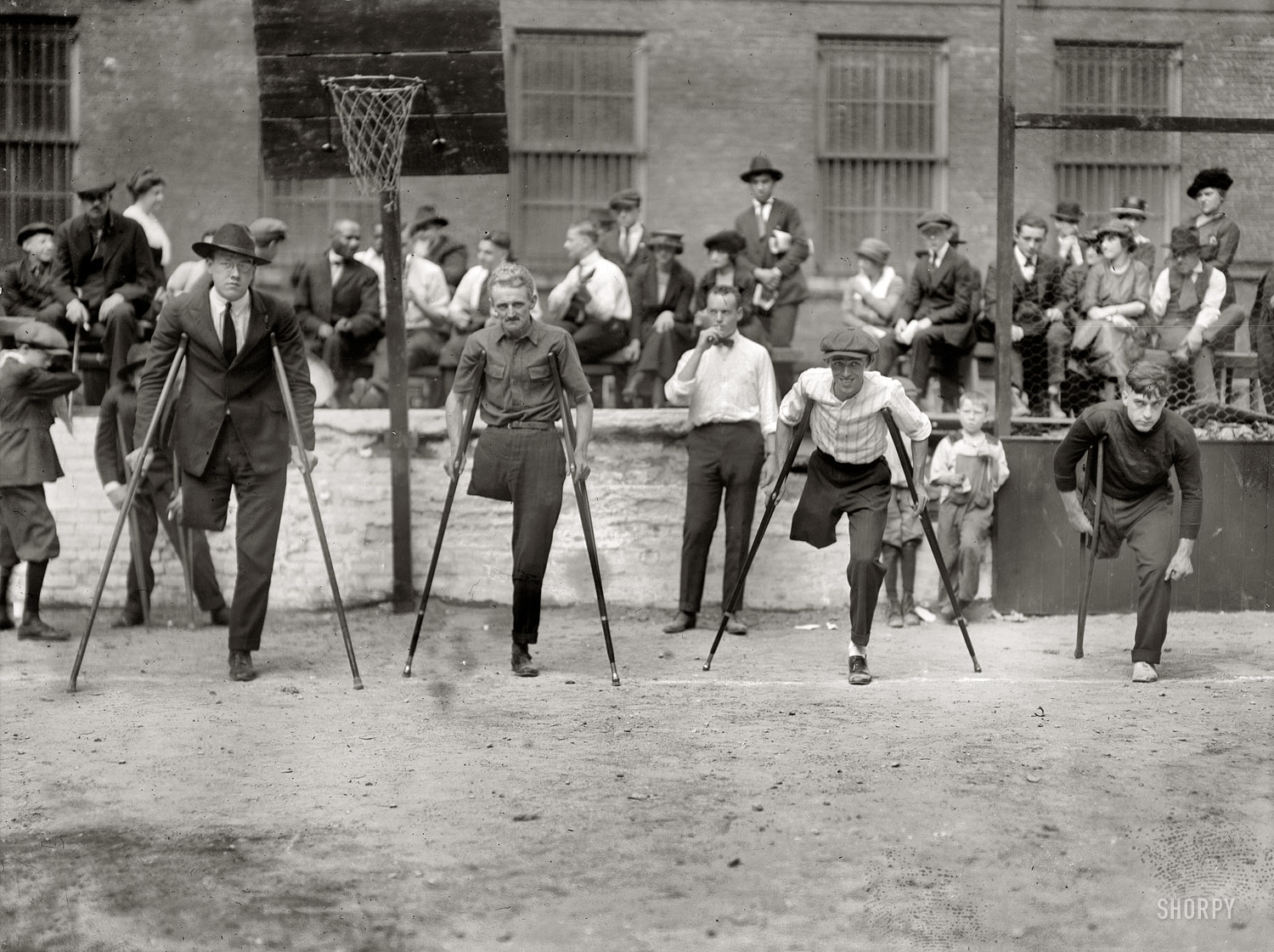 New York City circa 1918. "Start of cripples' one-legged race." 5x7 glass negative, George Grantham Bain Collection. Library of Congress. View full size.