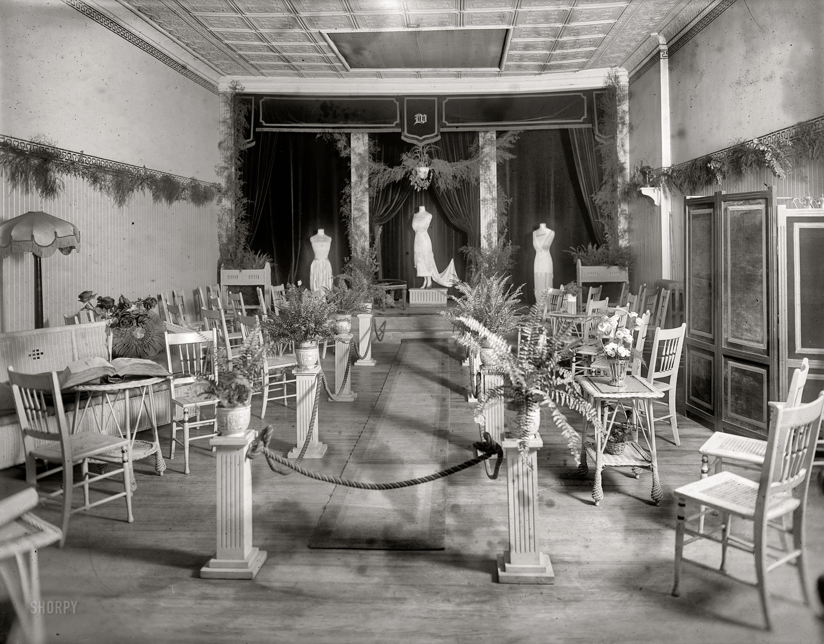 Washington, D.C., circa 1920. "Interior, Wells Corset Shop." Where that hourglass figure is just a whalebone away. National Photo glass negative. View full size.