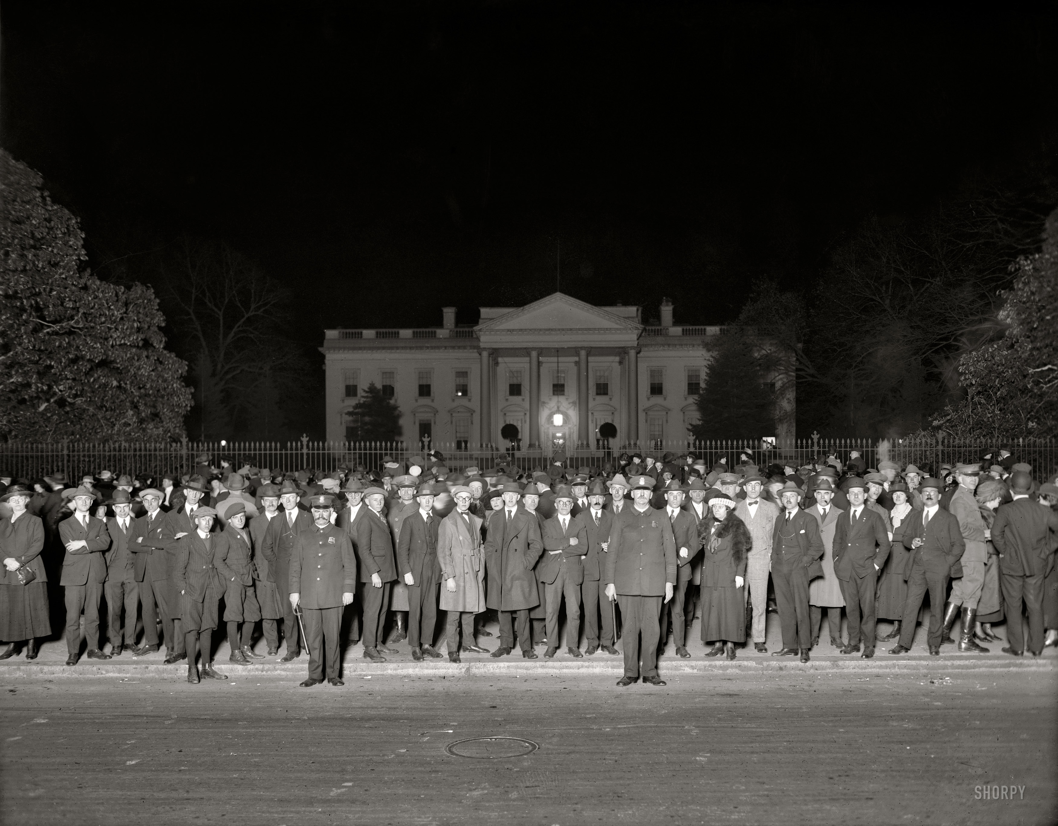 "Election night crowd at White House, November 1920." The chosen one was Warren Harding. National Photo Company glass negative. View full size.
