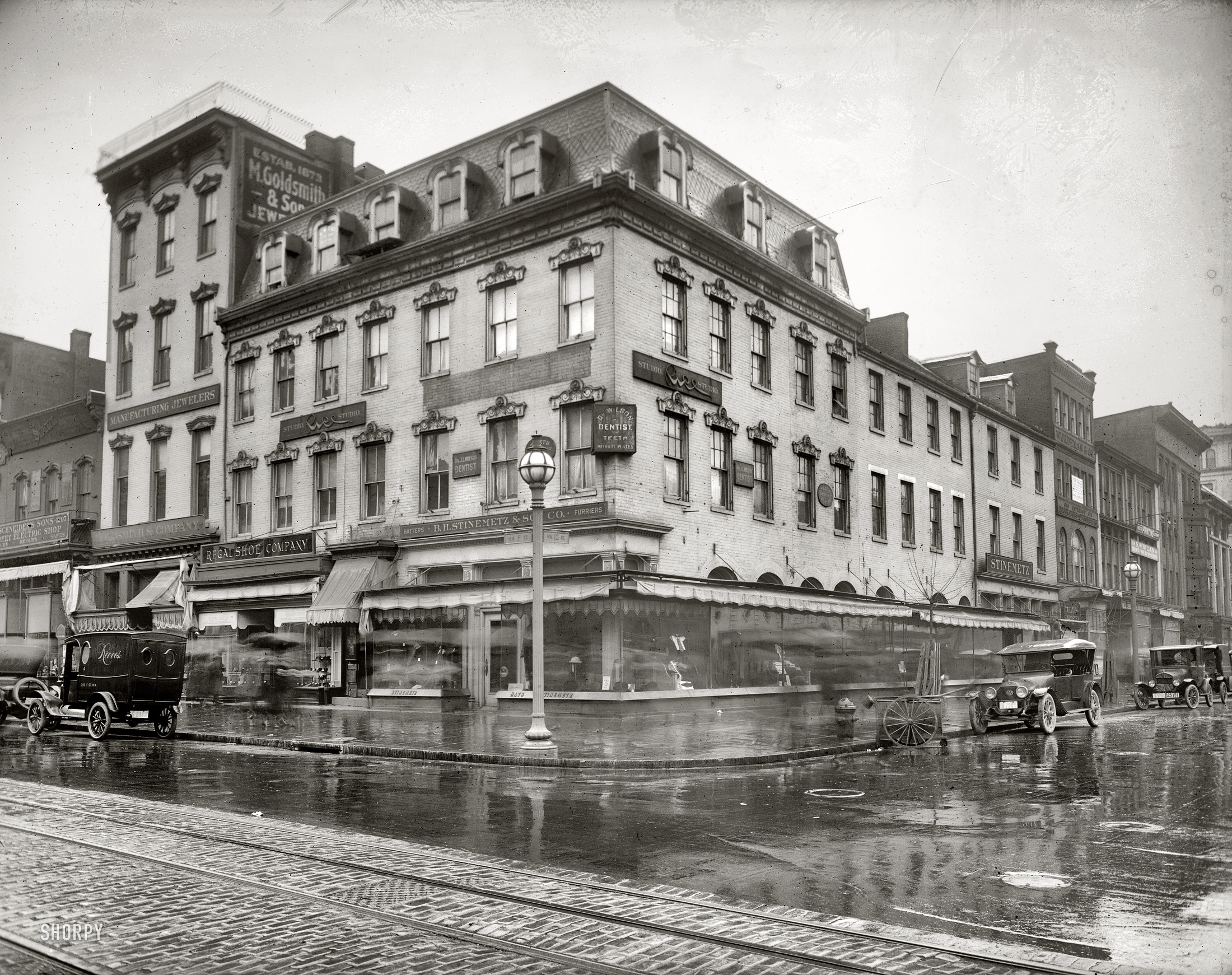 "Stinemetz Building, 12th and F streets N.W." A rainy day in Washington, D.C., in 1921. National Photo Company Collection glass negative. View full size.