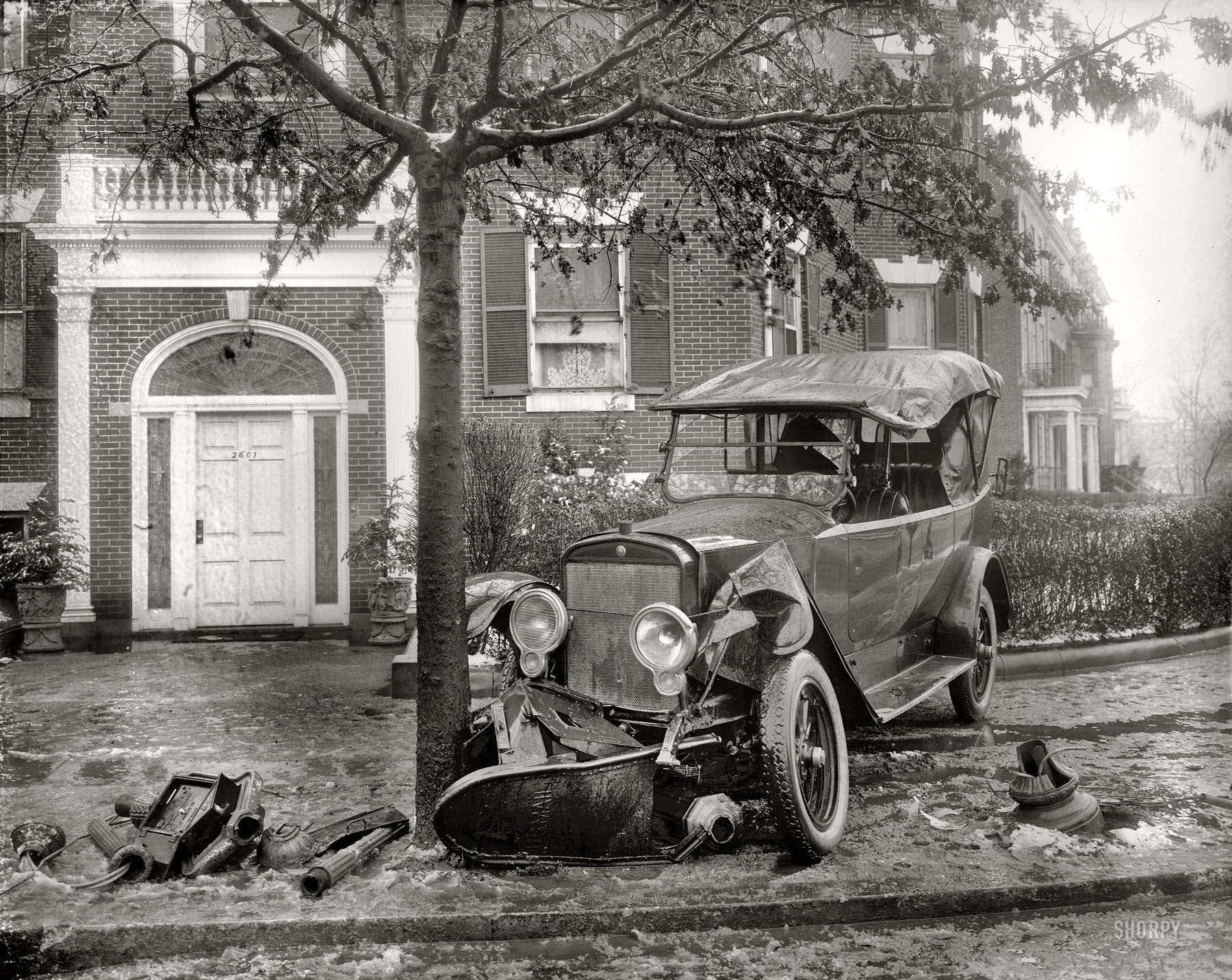 January 1921. Washington, D.C. "Penrose car, accident." Beside Senator Boies Penrose's car, casualties here include a mailbox, emergency call box and a lamppost. The tree survives with a dented trunk. View full size.