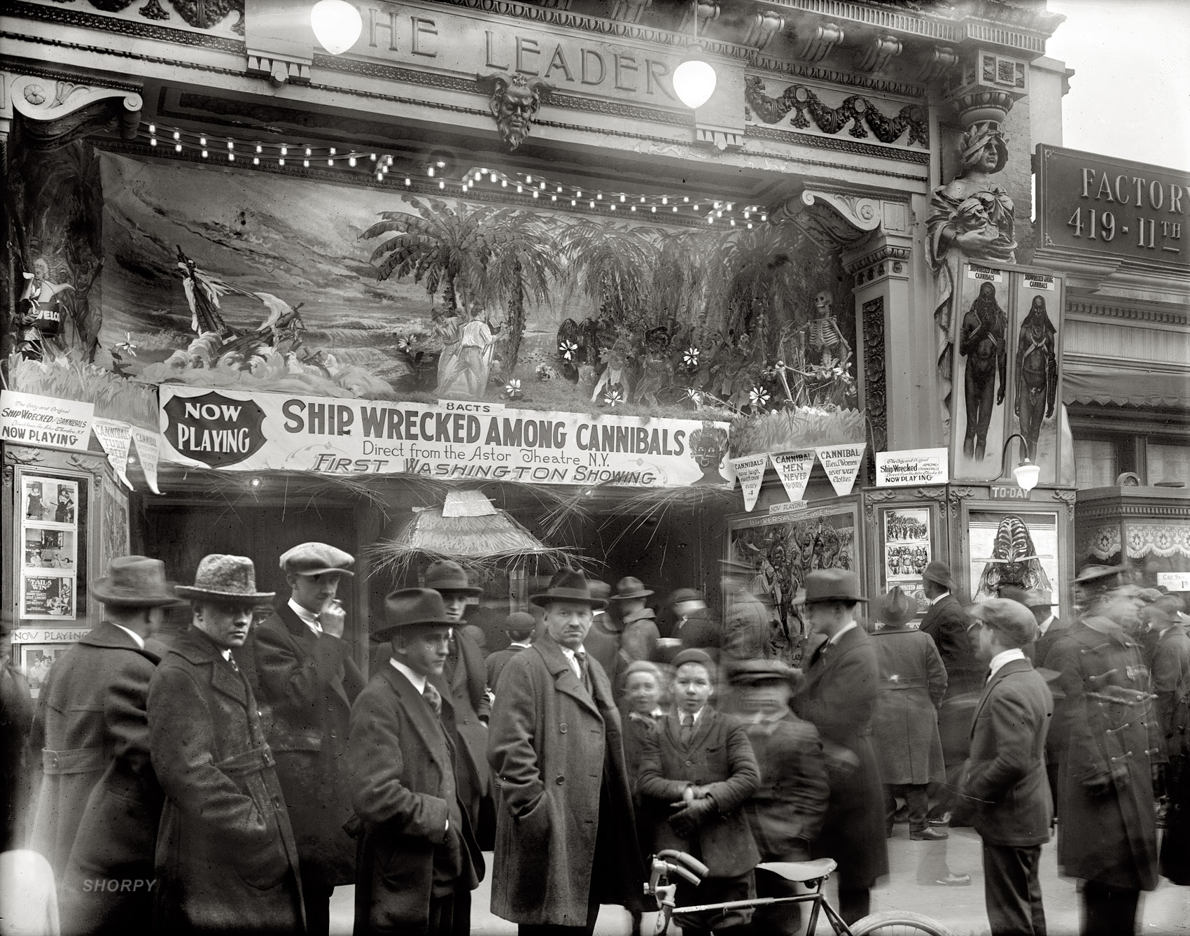 Washington, January 1921. Now playing at the Leader: "Shipwrecked Among Cannibals." Just loitering outside for a few minutes is practically a graduate course in cannibal lore. View full size. National Photo Company glass negative.