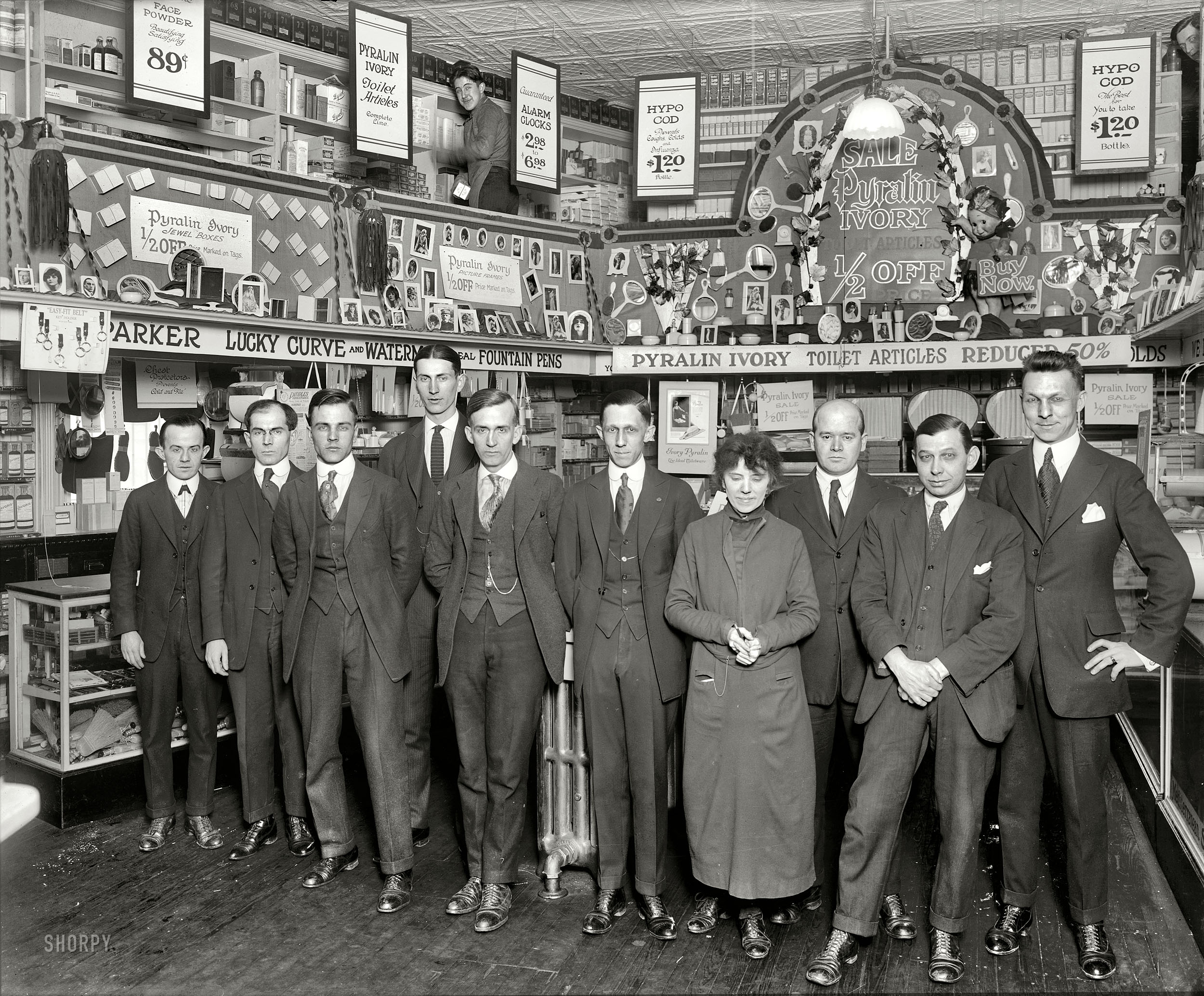 Washington, D.C., circa 1921. "People's Drug Store group, 7th and K Streets." The folks behind (and in front of) the vibrator display seen in this post. National Photo Company Collection glass negative. View full size.