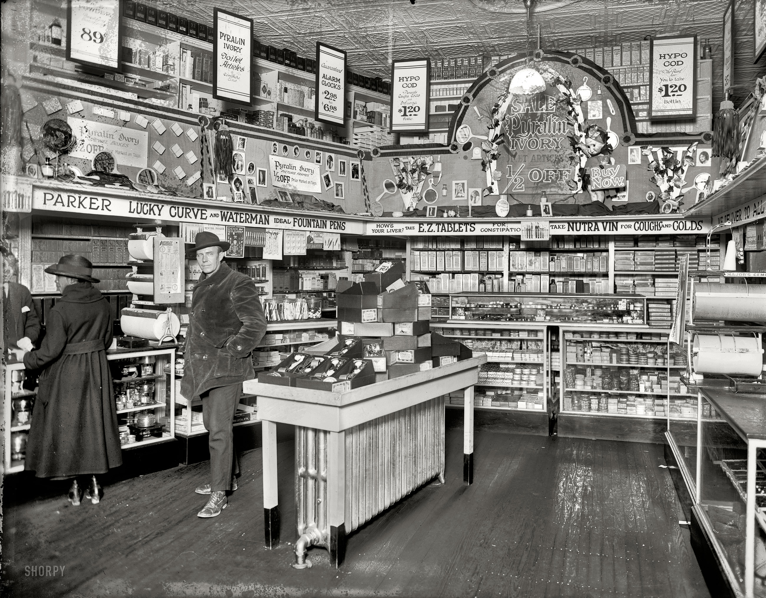 1921 or 1922. "People's Drug Store, 7th and K." On the table: a nice assortment of Star vibrators. This is a new version of a photo originally posted Aug. 15, 2007. In what counts as an exciting curatorial development here at Shorpy, the glass negative is now available for this image (a.k.a. "the vibrator photo"), as opposed to the previous version made from the scan of a print. The new version is a lot sharper, and shows more of the store. The caption info also gives the address, which we didn't have last year. National Photo glass negative. View full size.