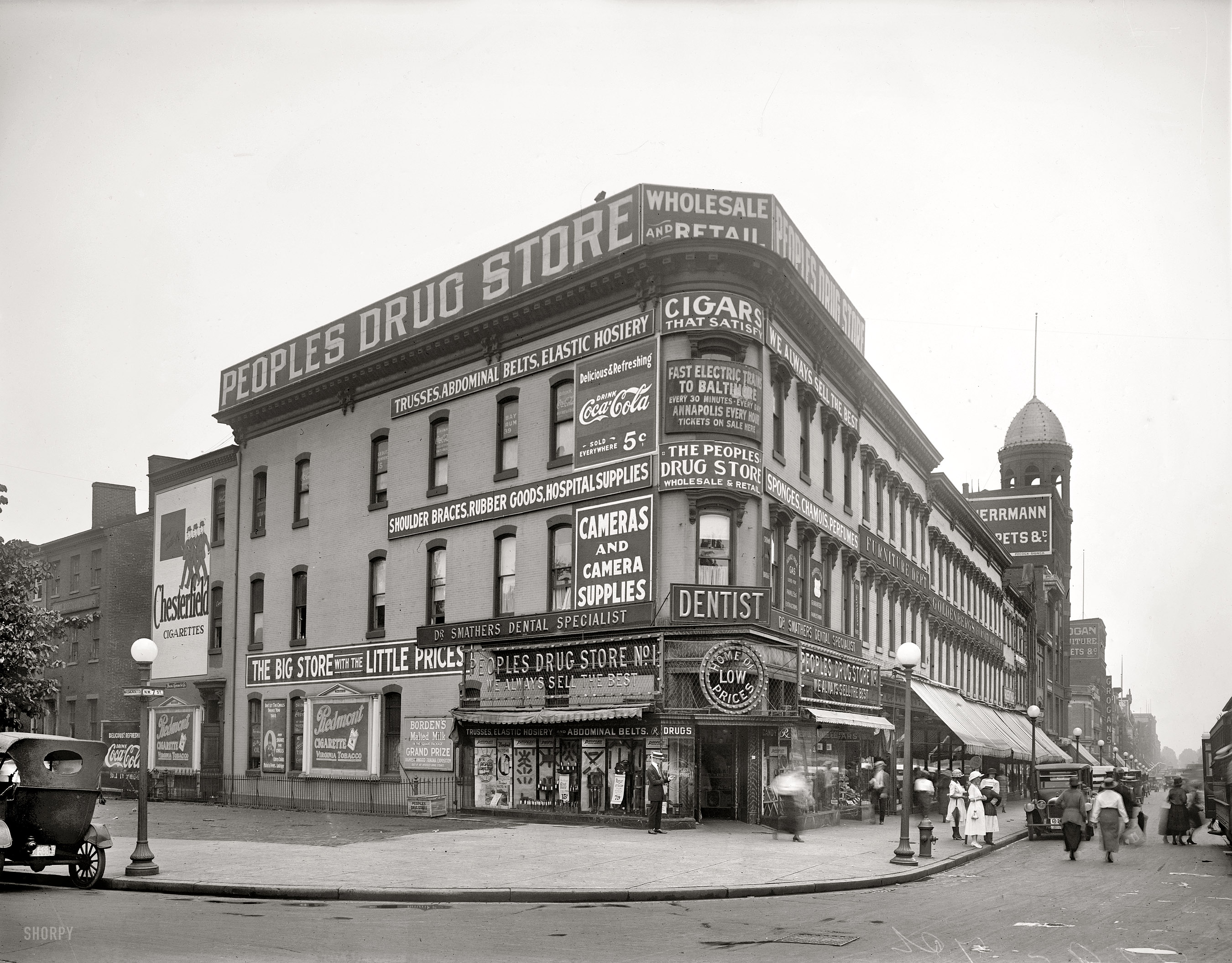 Washington, 1921. "People's Drug Store, 929 Seventh Street N.W., exterior." The scene at Mass and Seventh, evidently the hernia capital of our nation's capital. National Photo Company Collection glass negative. View full size.