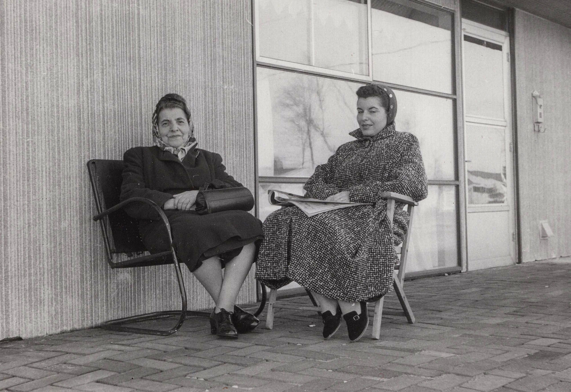My mother sits with her mother on what must have been a chilly day in the Dogwood section of Levittown, Pennsylvania. They were enjoying the new front porch that my father built out of stones, sand and bricks.

The siding behind them was red and white and made of asbestos. On a 2018 drive through Levittown I could only see one house where this type of siding was still visible, while on others it could be hidden beneath newer siding.