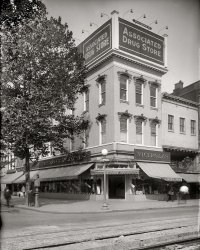 Washington, D.C., circa 1921. "Louis &amp; Co., Seventh and G." A convenient grouping of Victrolas, painless dentistry and patent advice. View full size.
What We Have, You Get

Washington Post, Dec 20, 1914 


Gets New Drug Store
Company Begins Business Tomorrow at 7th and G Sts.

The opening of the Washington branch of the Associated branch of the Associated Drug Stores, Seventh and G streets northwest, tomorrow morning, marks the acquisition of one of the finest and most modern establishments of its kind here.  The drug company, of which Dr. M.M. Whitehurst is president, has four stores in Baltimore, and has met with success there.
The new establishment will feature its opening tomorrow by giving away souvenirs, including candy, flowers, perfume, and other things with purchases of 50 cents and over.  Flowers will be given tomorrow and Tuesday to ladies.
There will be various departments of the new establishment, including the prescription, cigar, soda fountain, candy, as well as general drug department.  The prescription department which is especially well fitted, will be in charge of two registered graduate pharmacists, and will be able to fill prescriptions on short notice.
Another feature is the 30-foot soda fountain, said to be the largest in this section of the country.  It will be in the charge of competent men, and is strictly hygienic.  Sterilized glasses, filtered water, and fresh fruits will be attractions.
The management will make a specialty of guaranteeing everything that is sold in the store, and if anything is not entirely satisfactory it can be returned and either money refunded or another article given in its place.  "Best goods at the lowest prices," is the motto of the company.
The new store building, which is centrally located, was formerly occupied by a branch of the United States Trust Company.  The inside of the structure was torn out, and handsome new fixtures substituted at great expense.  The interior finish of the store is in white. Wall showcases have been used throughout so that the customer may see everything.  This is sad to be an innovation for Washington.  The proprietors will make a specialty from time to time of great bargains in the drug, candy, and other departments.


What We Have, You Get

Count &#039;EmI see about 28 Nippers.  There are a couple more suspects, but I can't tell without more magnification (or younger eyes).
Street ViewAmazingly similar today...
View Larger Map
Hardest working dentistAmazing, Dr. Truett's hours are 8am-9pm! 
WhereIs the Drug Store?
[To the left of Louis &amp; Co. - Dave]
The Moran BuildingThe Moran Building at 501-509 G Street NW in the Chinatown neighborhood of Washington was built in 1889 by J.E. Moran (first three floors; fourth floor and mansard roof added in 1890 by George Bogus) and is an example of Second Empire architecture. In 1983 it was added to the National Register of Historic Places. Current tenants include a Burger King restaurant.
[As noted above, the Moran is not the building in our photo. - Dave]
Misplaced MoranThe Moran Building with the Burger King is actually a block over, on the other side of Verizon Center.
+95Below is the same view from May of 2016.
(The Gallery, D.C., Natl Photo, Stores & Markets)